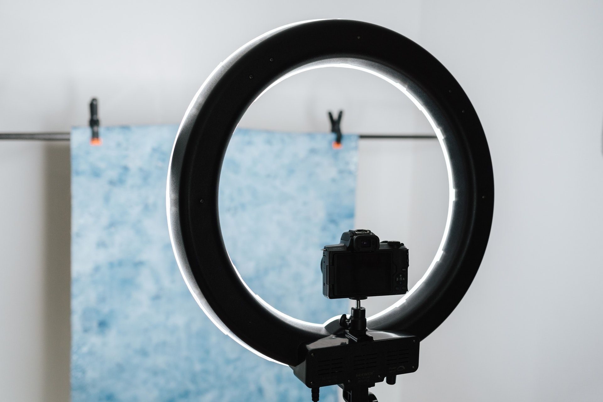 A tripod with a ring light