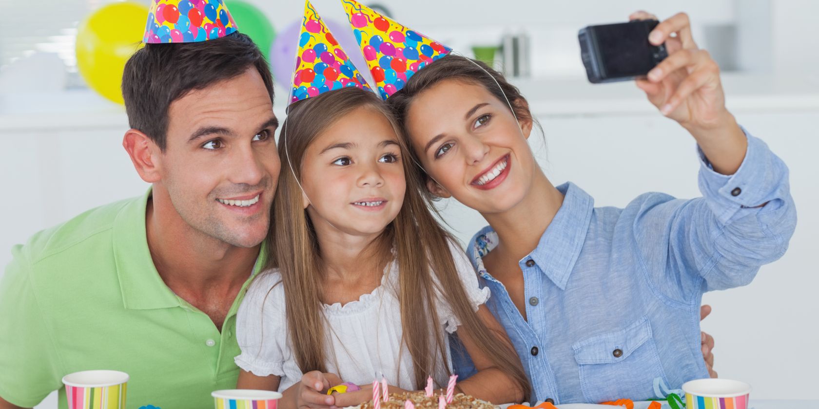 Family taking a selfie during a child's birthday party