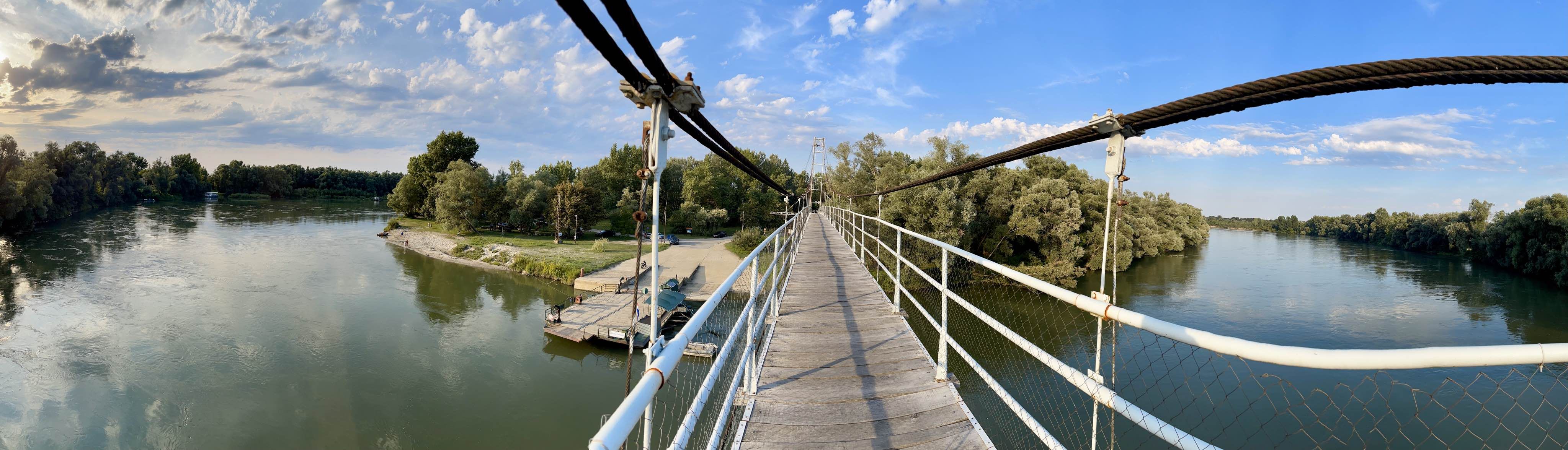 A panoramic photograph of an old river bridge taken with iPhone 12