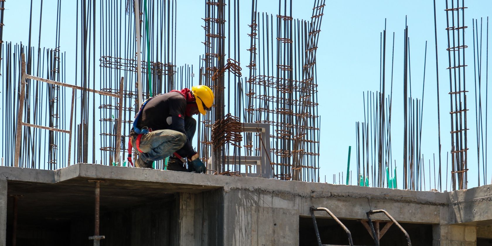 Photo of a person working on a constructio site 