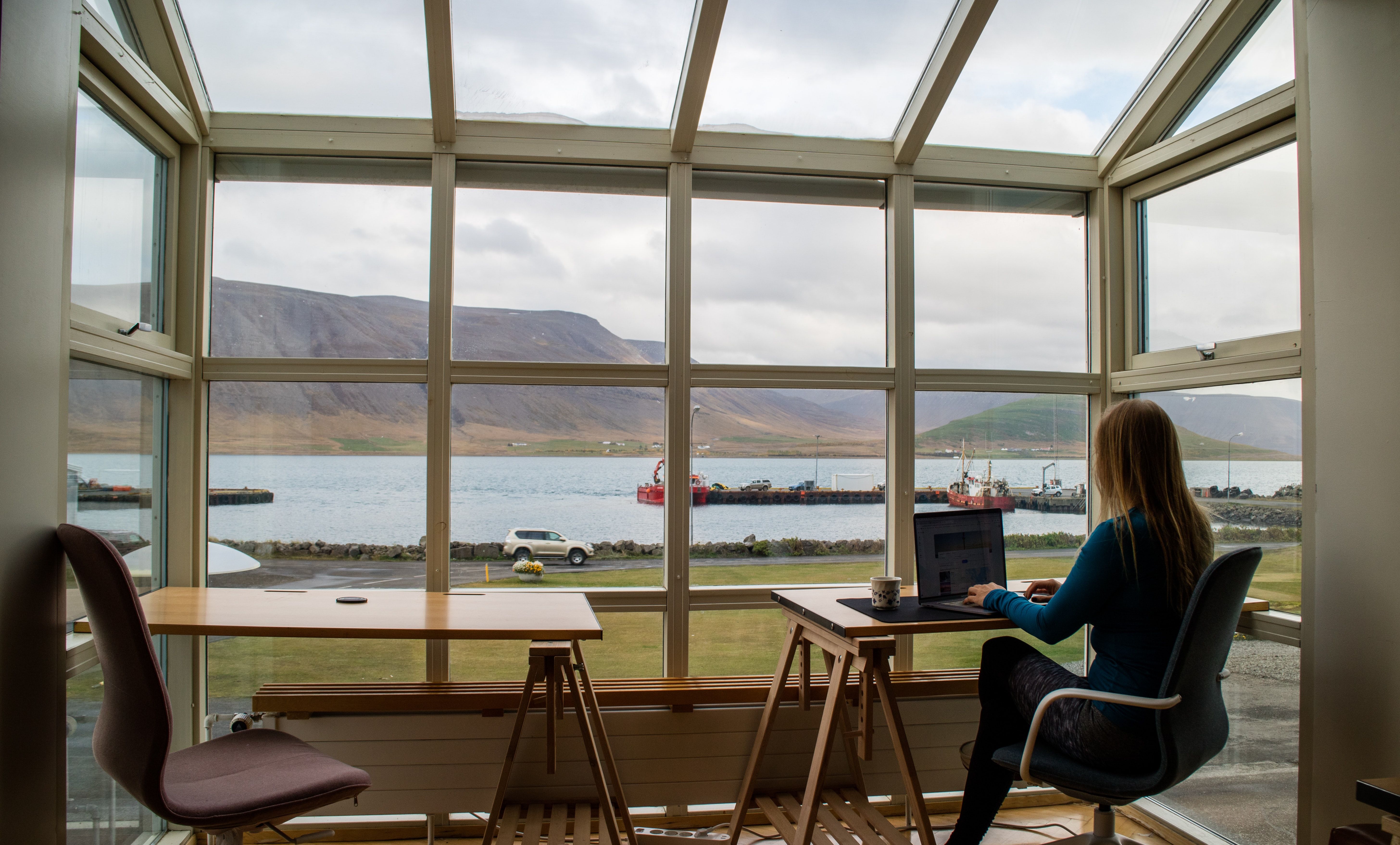 Photo of a person working in an office on their computer