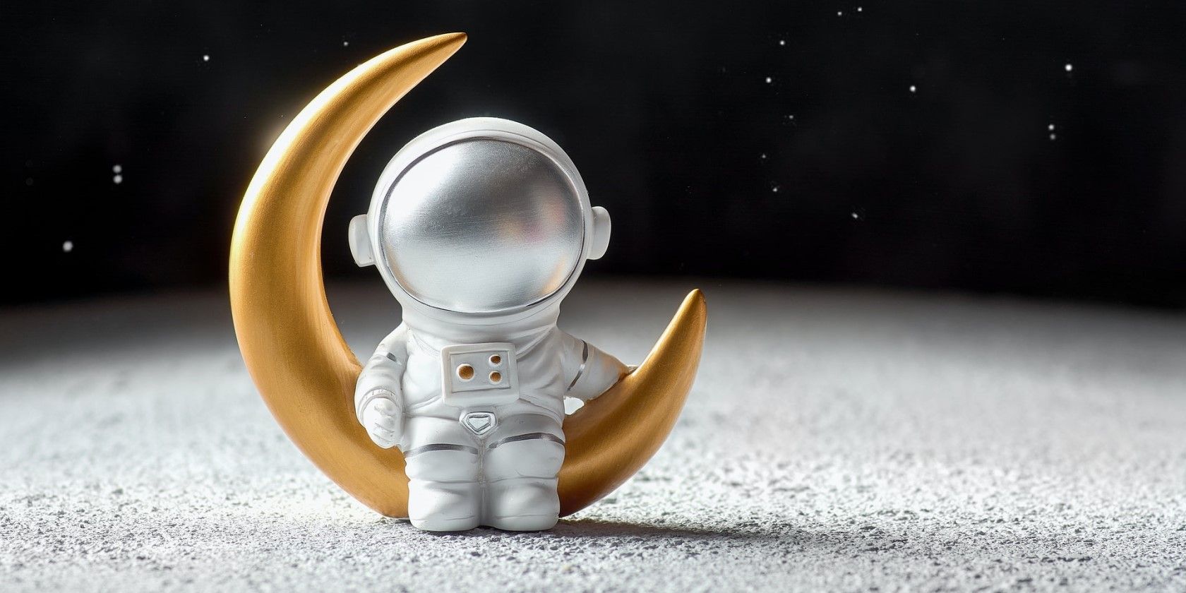 Astronaut sitting on a moon