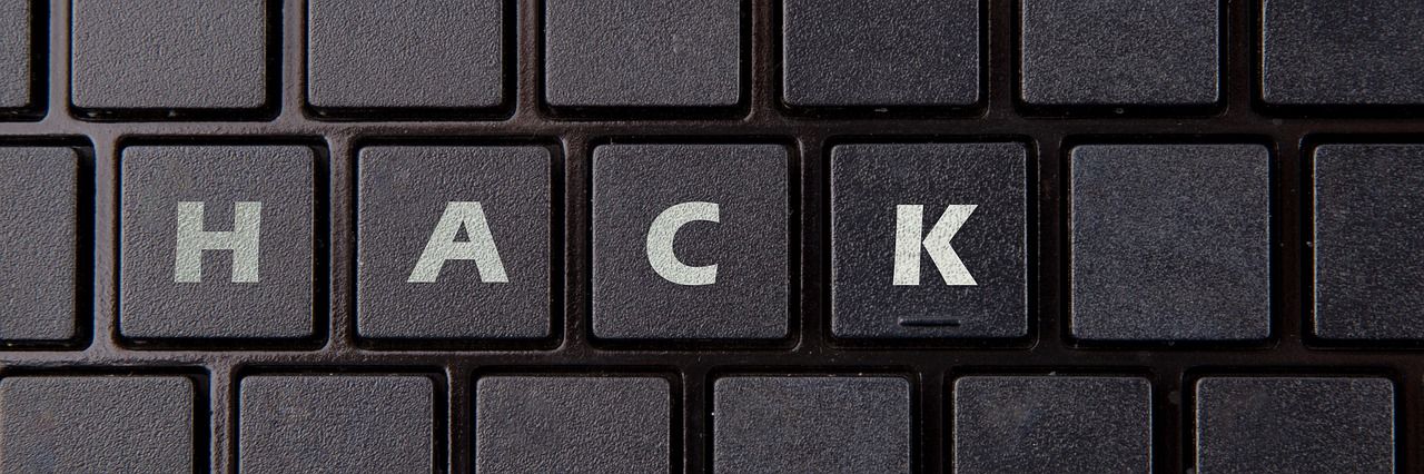 "HACK" written on keyboard
