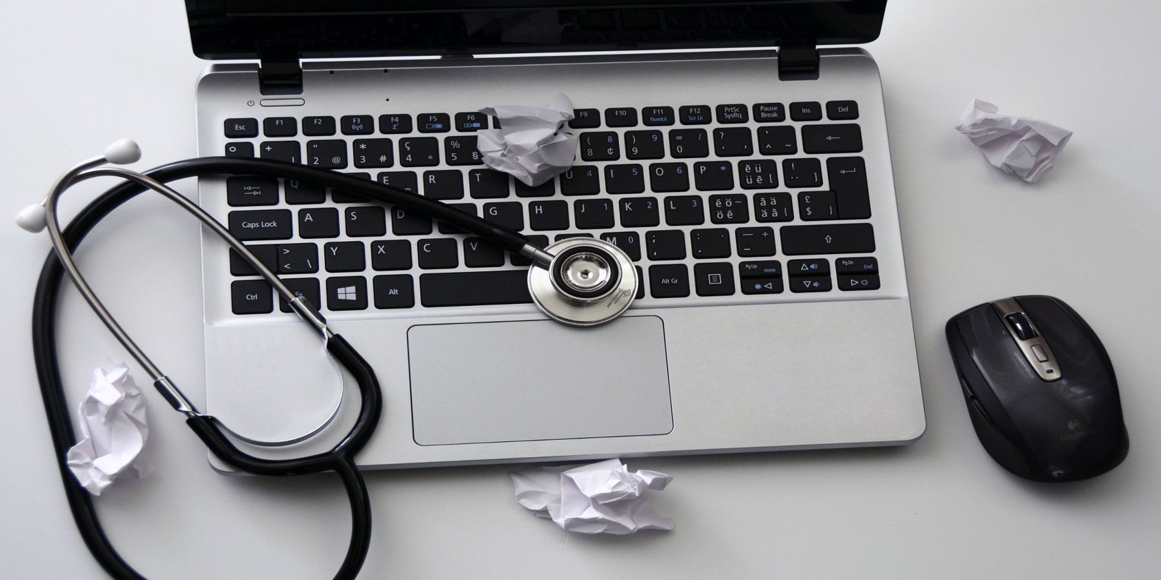 Laptop with stethoscope on top