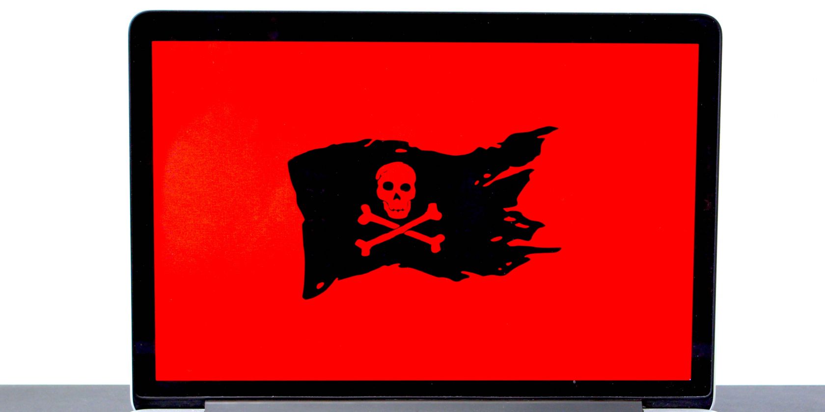 photo of a laptop with pirate symbol