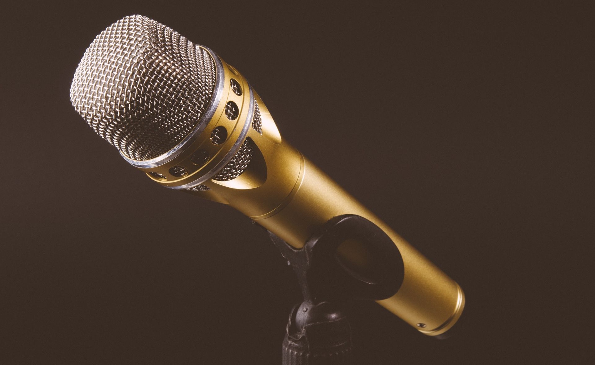 Golden microphone with black background