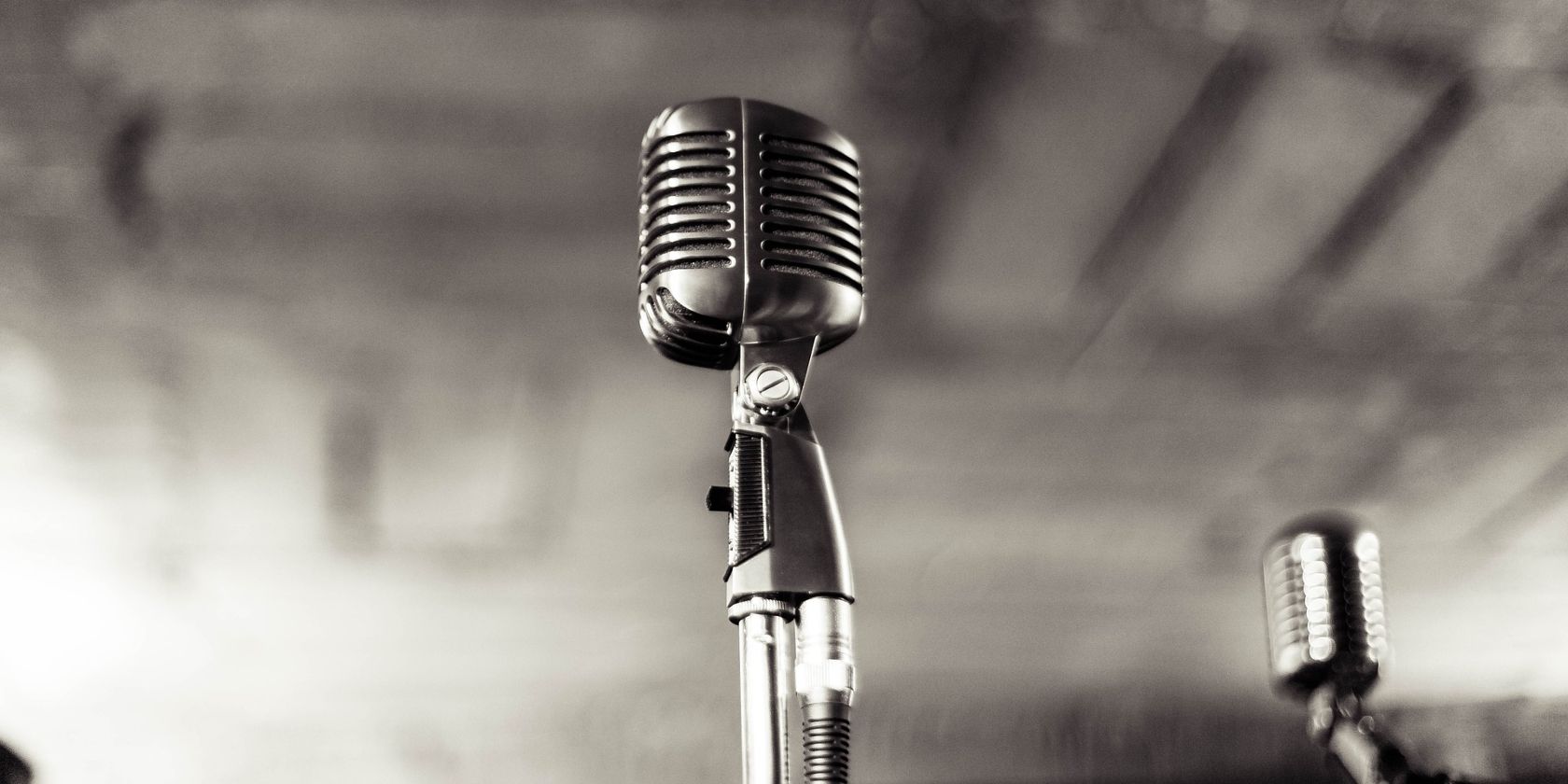 silver microphones with gray background