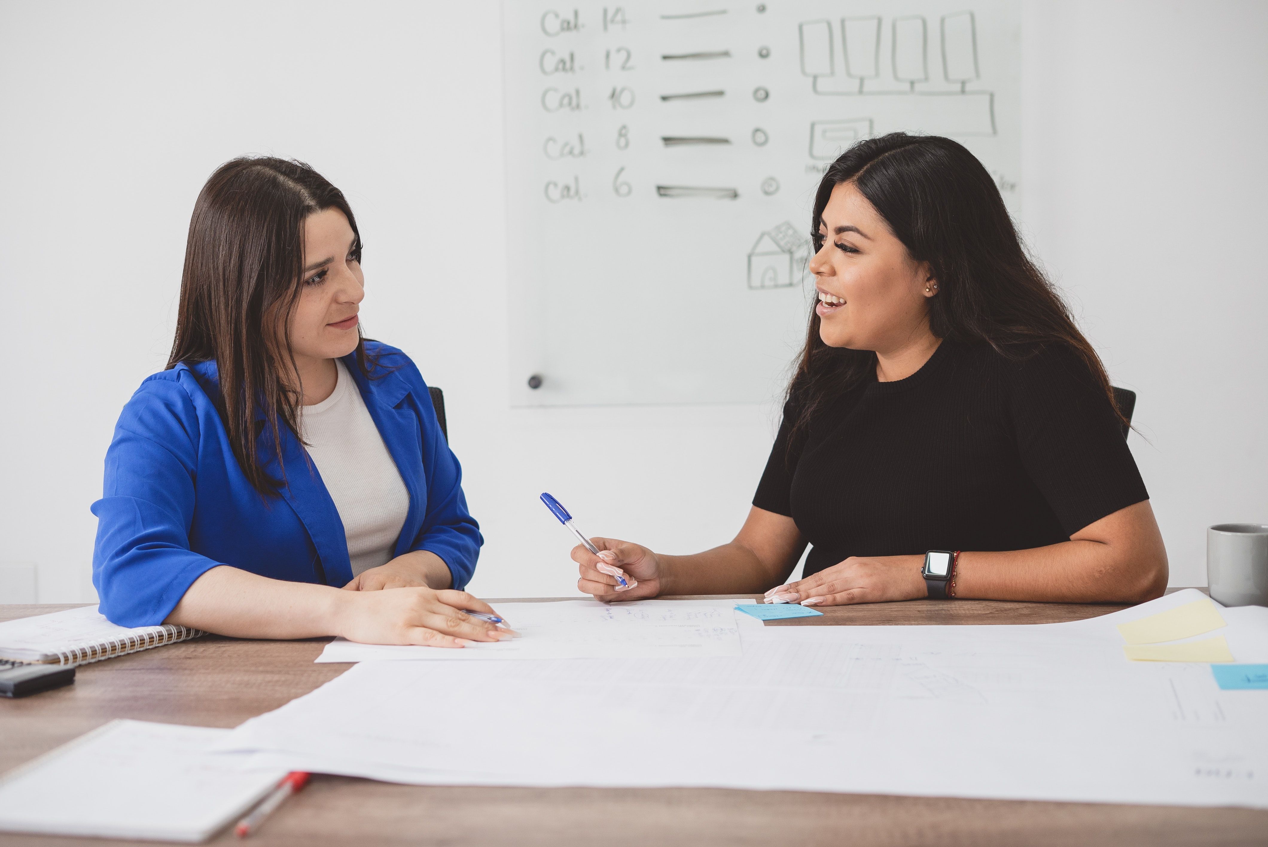 Two women planning about something