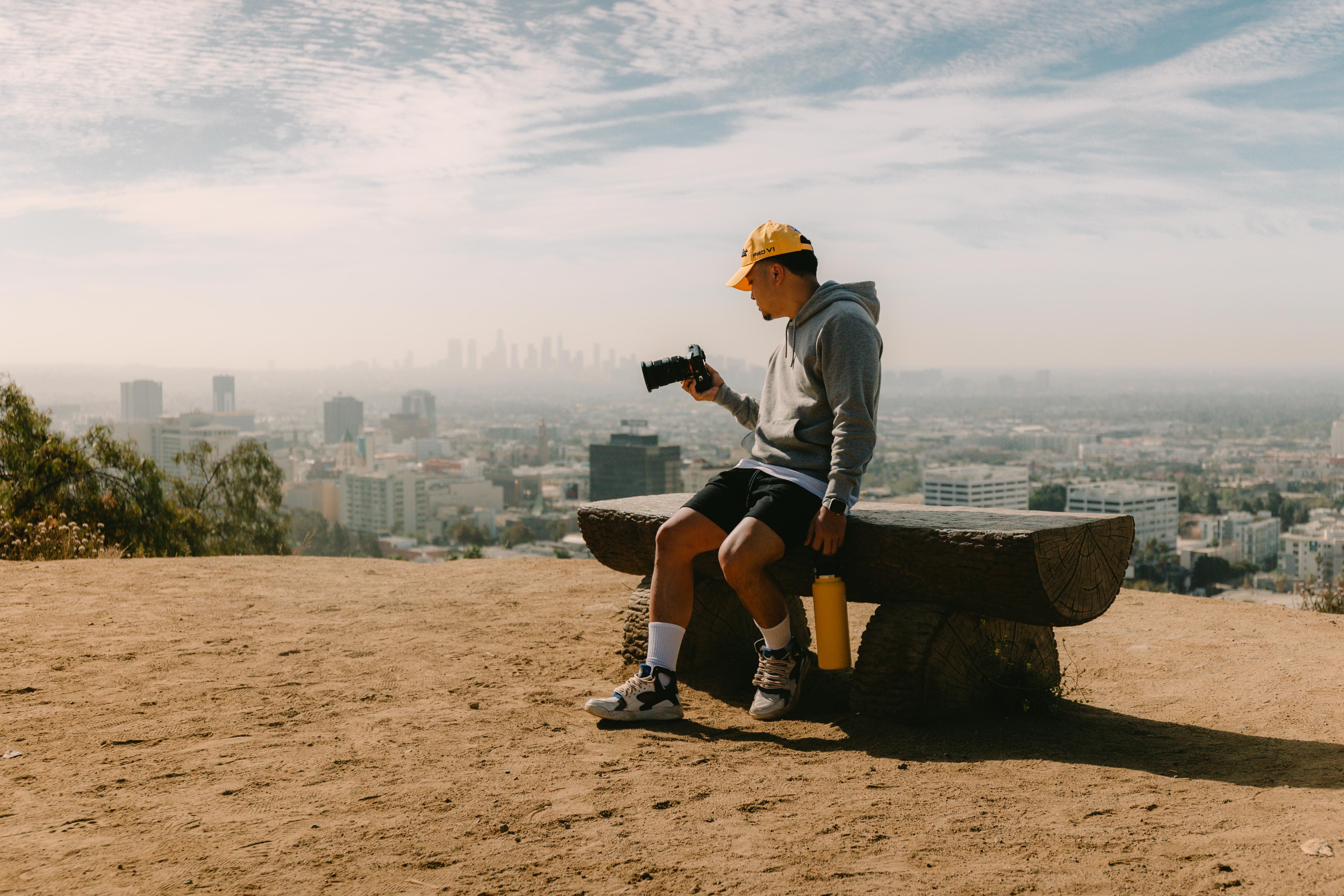 A photographer assesses his shot