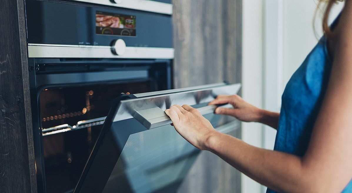 woman using smart oven