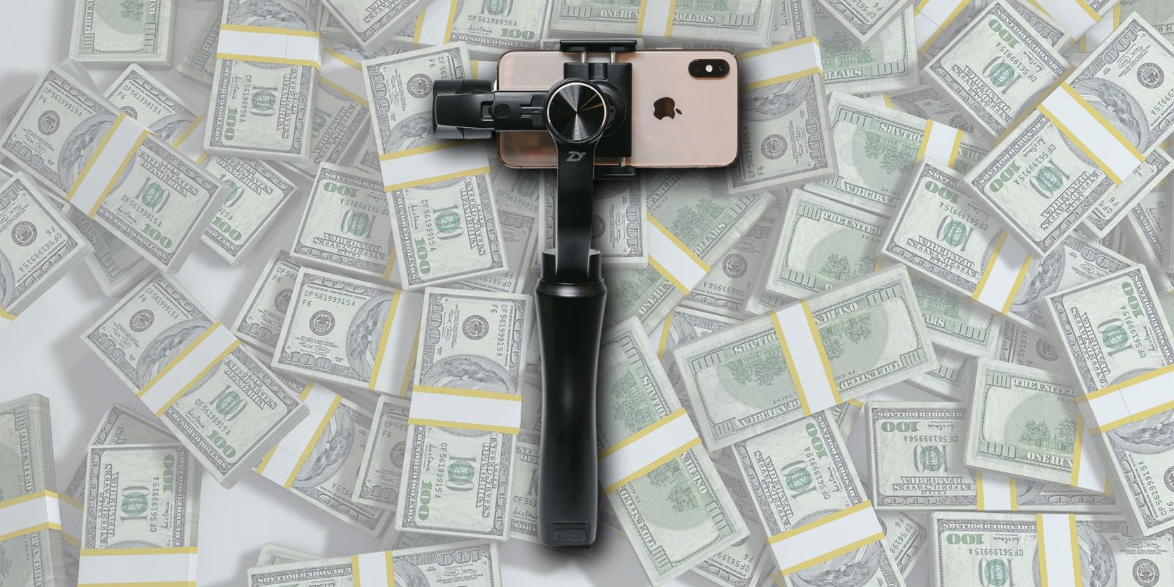 smartphone gimbal on a pile of money