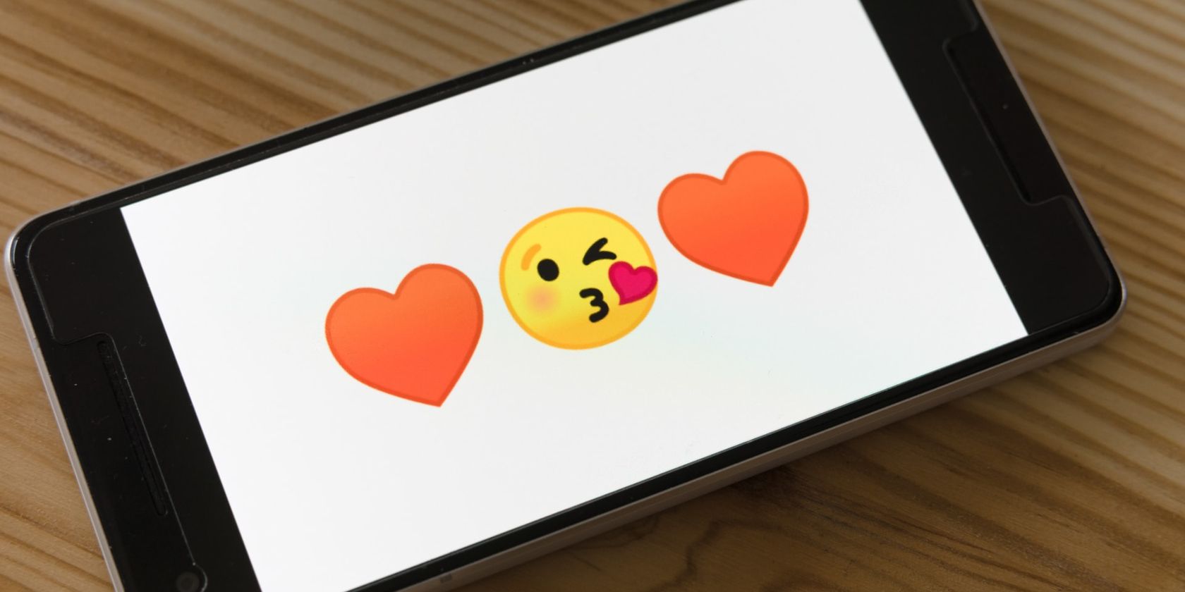 Smartphone With Emoji and Hearts