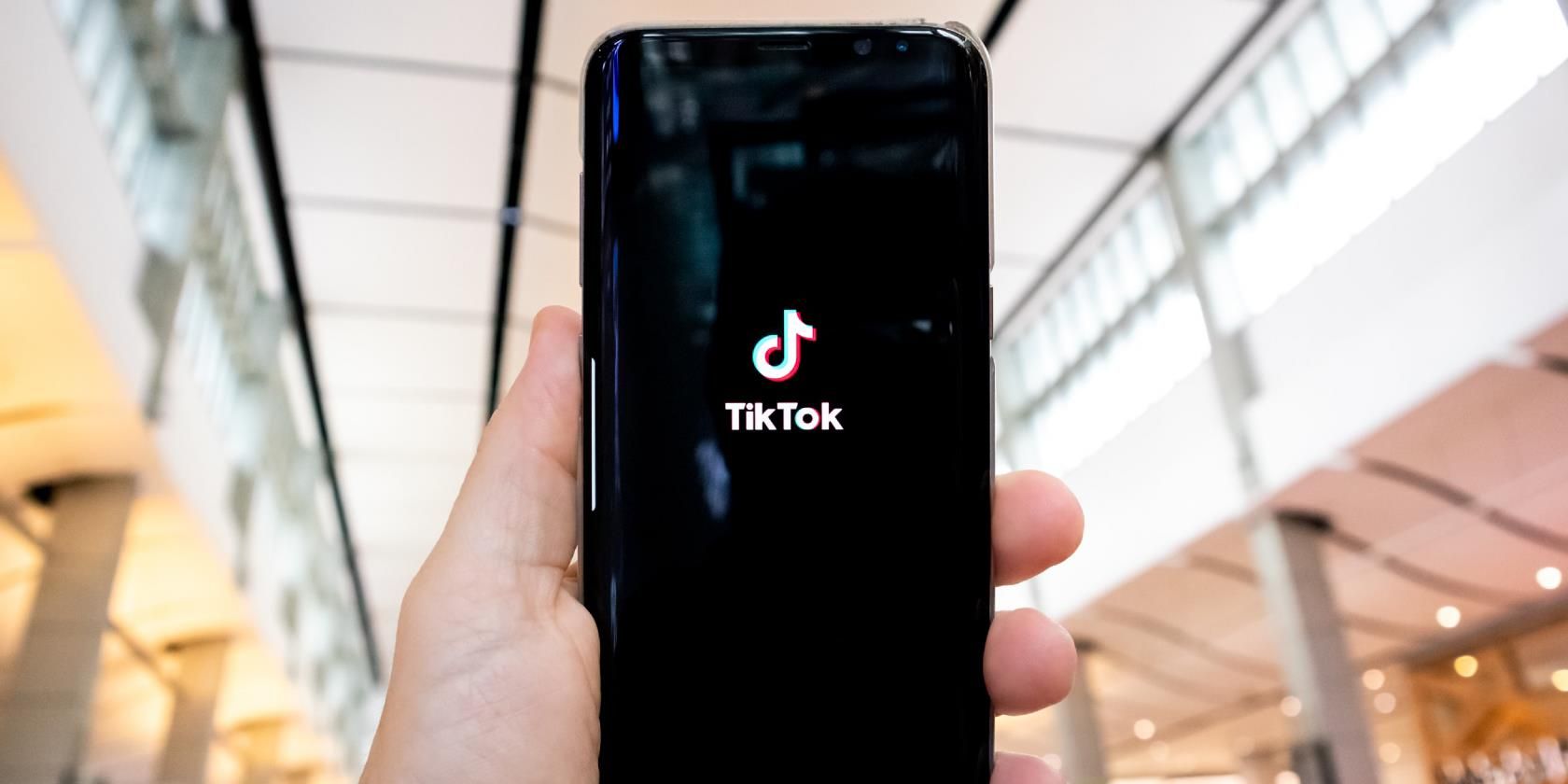 Photo of someone holding their phone with the TikTok app