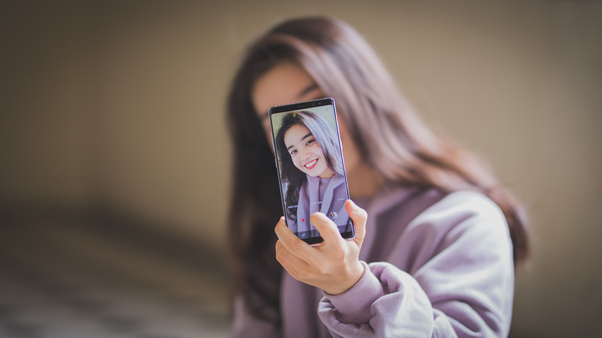 Woman Recording Selfie Video