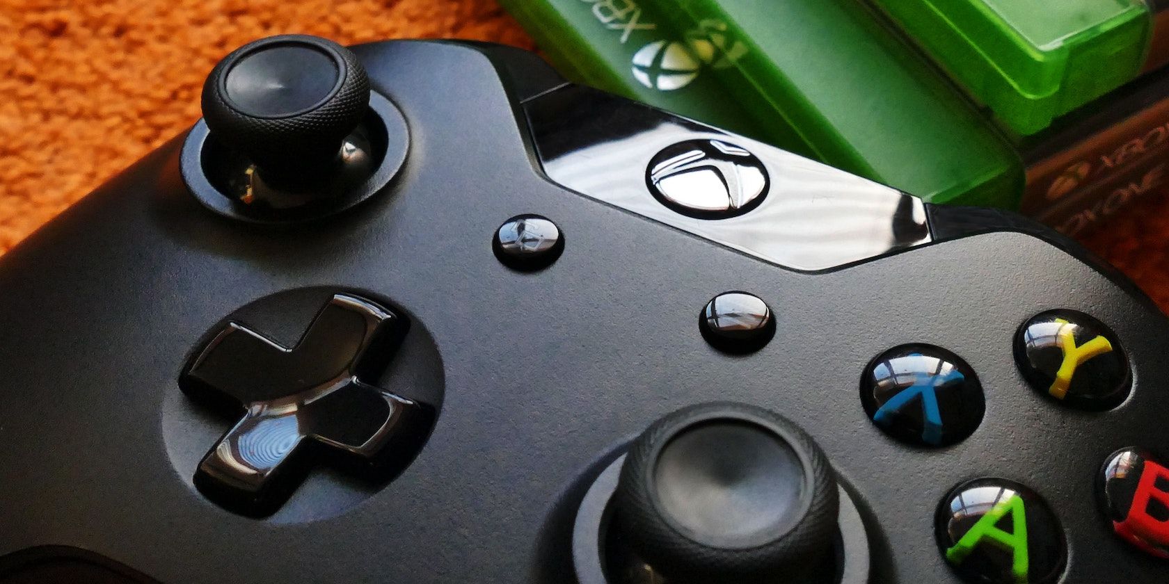 An Xbox controller with Xbox One games