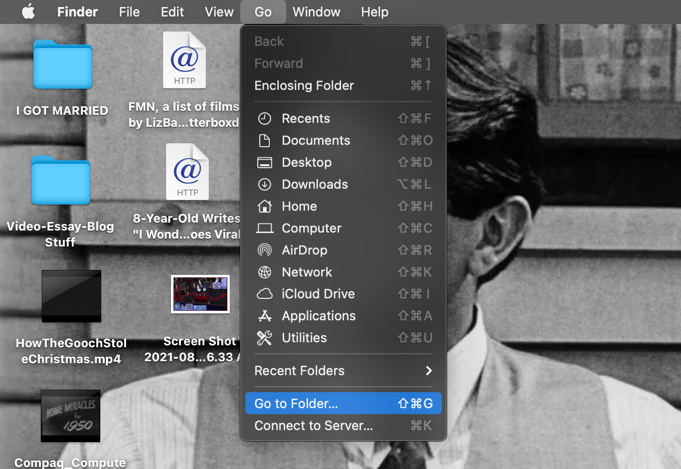 Finder's Go menu is open, with the Go to Folder option selected