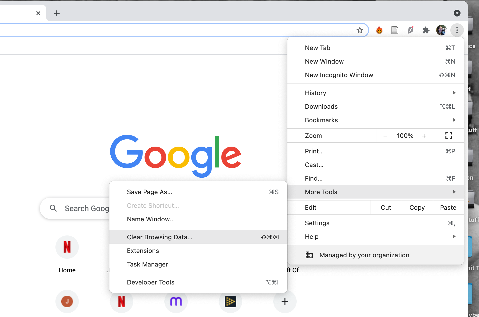 The Google Chrome More tools menu open on a MacBook Pro with Clear Browsing Data selected