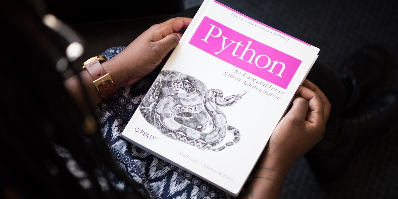 Hand holding a Python book