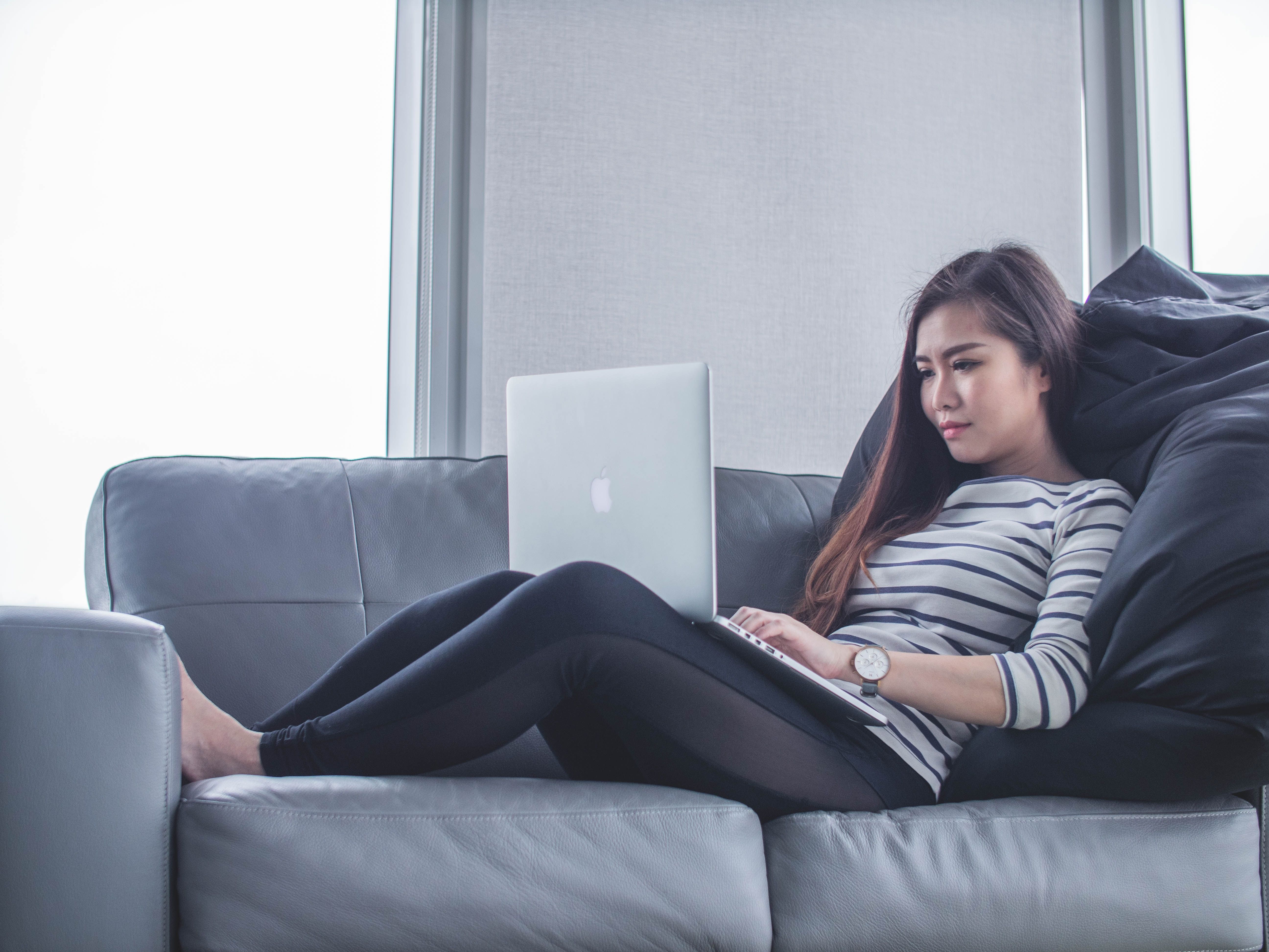 Person at rest using a Macbook