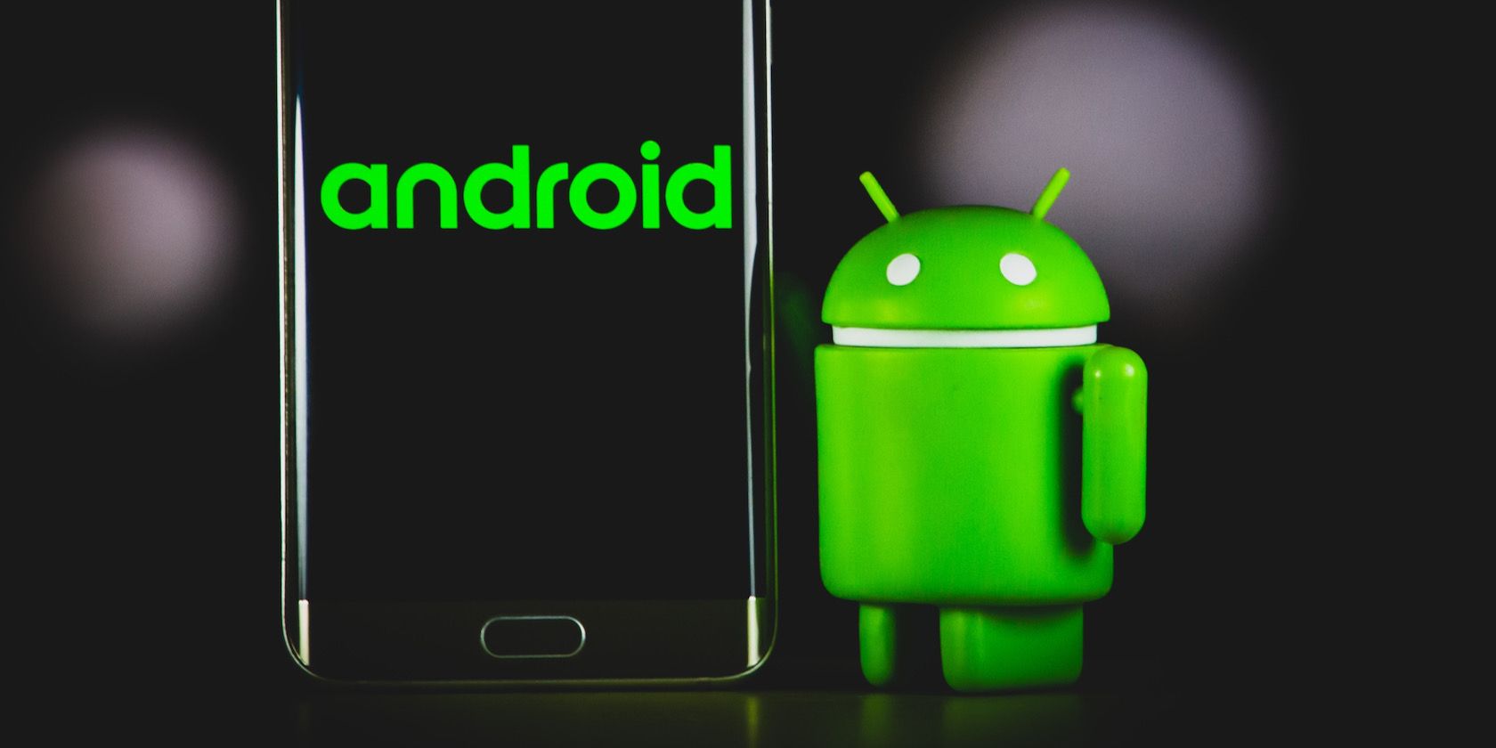 android logo on phone with android logo figure