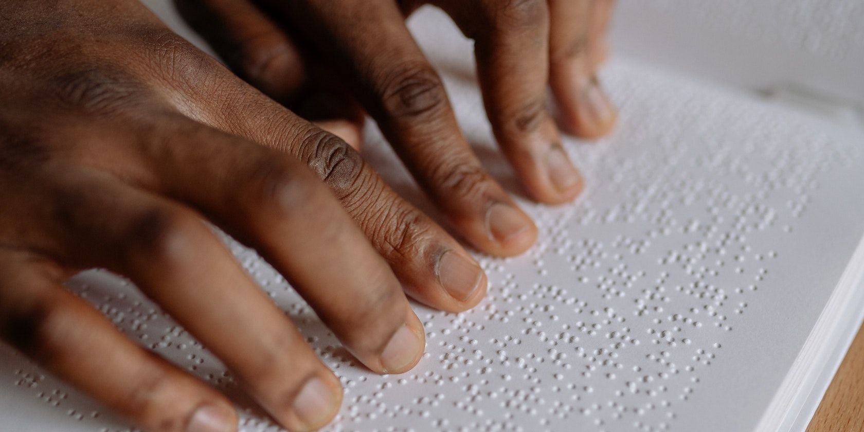 blind person using Braille