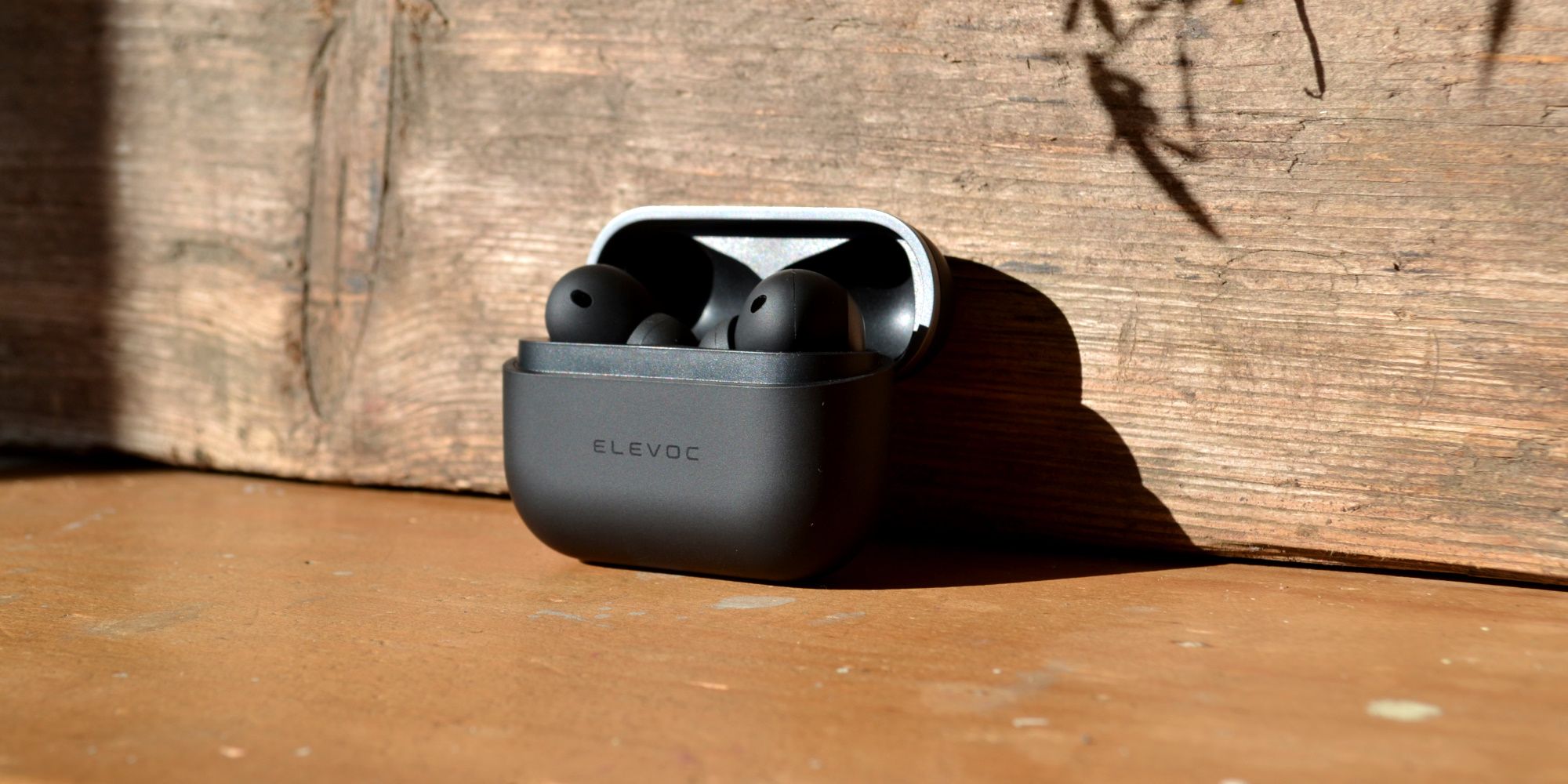 elevoc clear earbuds review case standing with buds