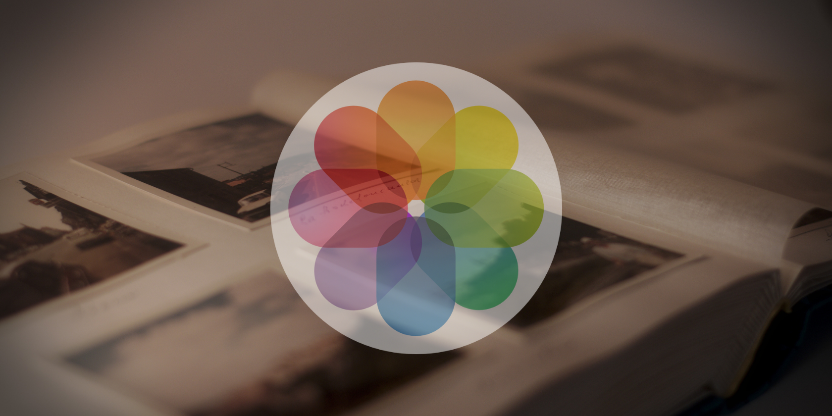 Apple Photos logo over a physical photo album.