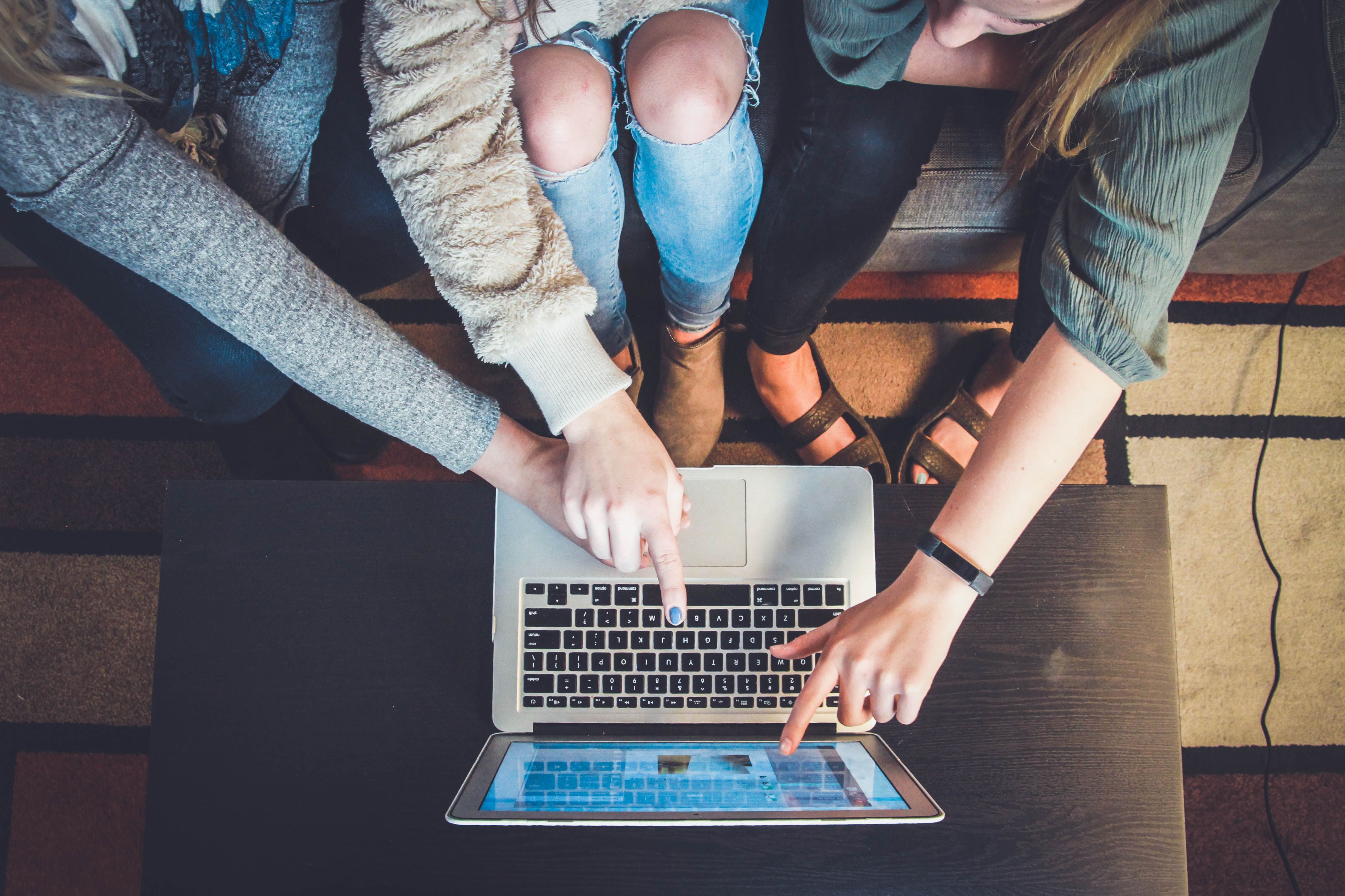 A group of people using a computer app together