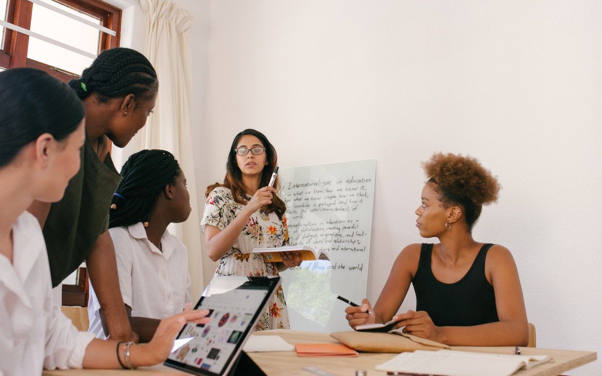 Five people having a meeting