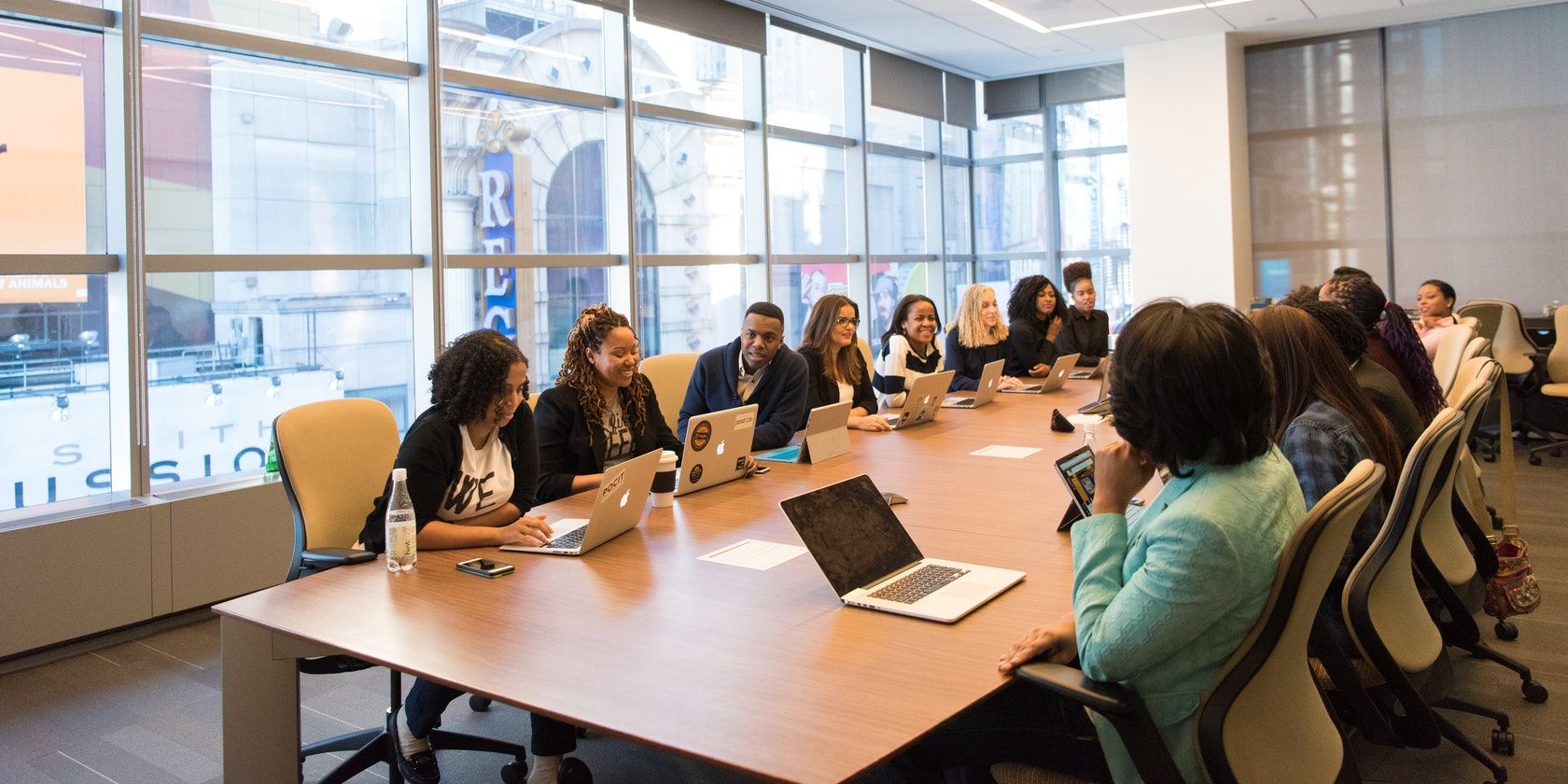 A group of people having a meeting in a conference room