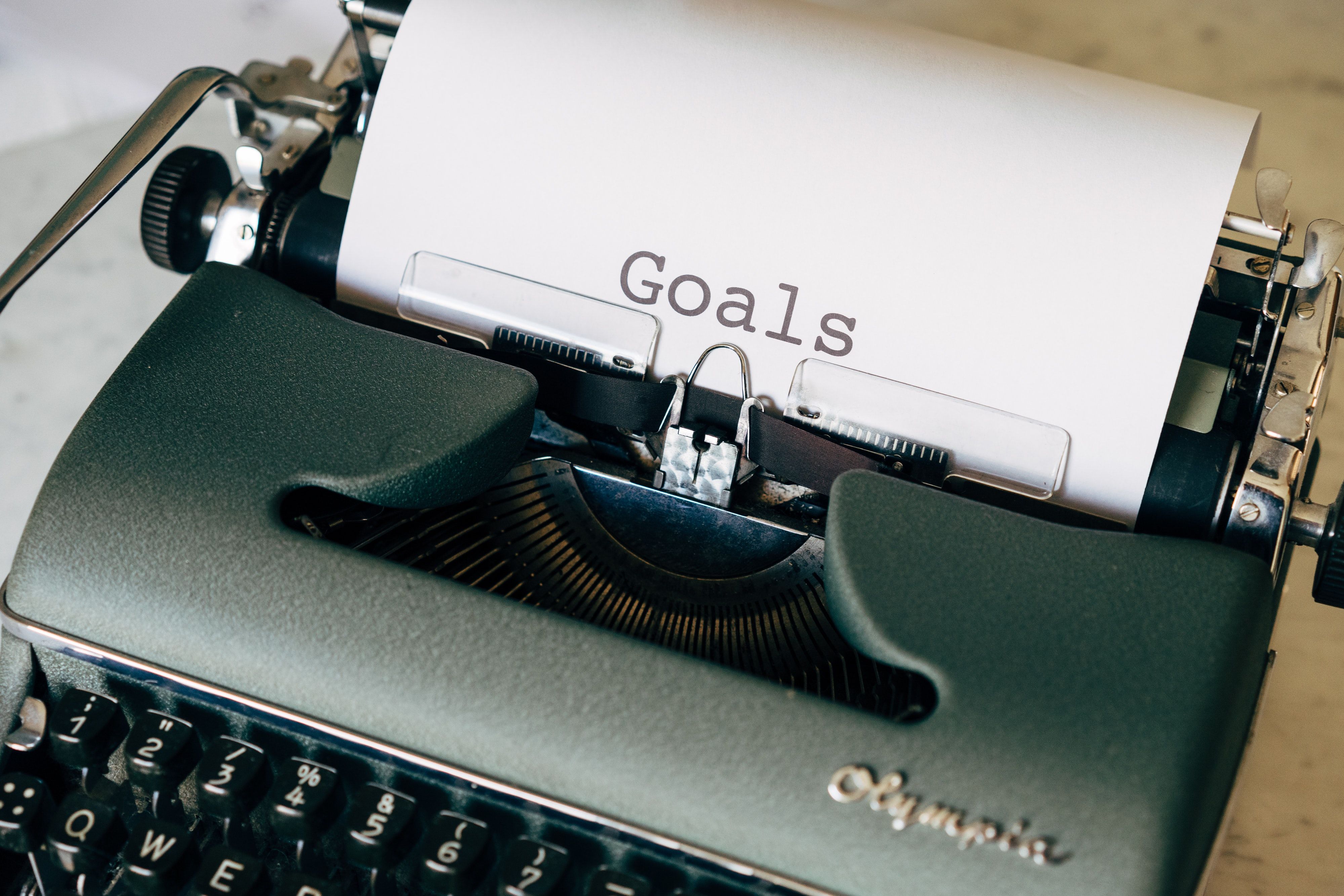A typewriter printing goals on a blank sheet