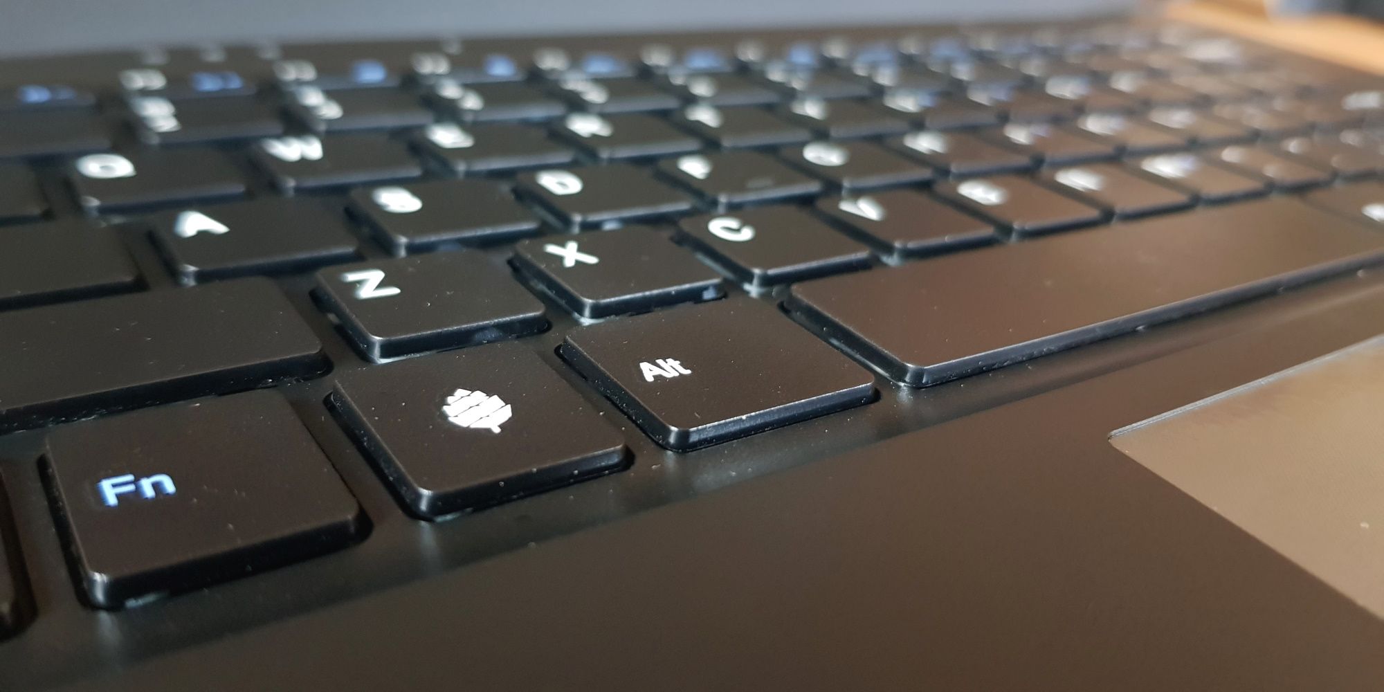 pinebook pro super button with pine64 logo