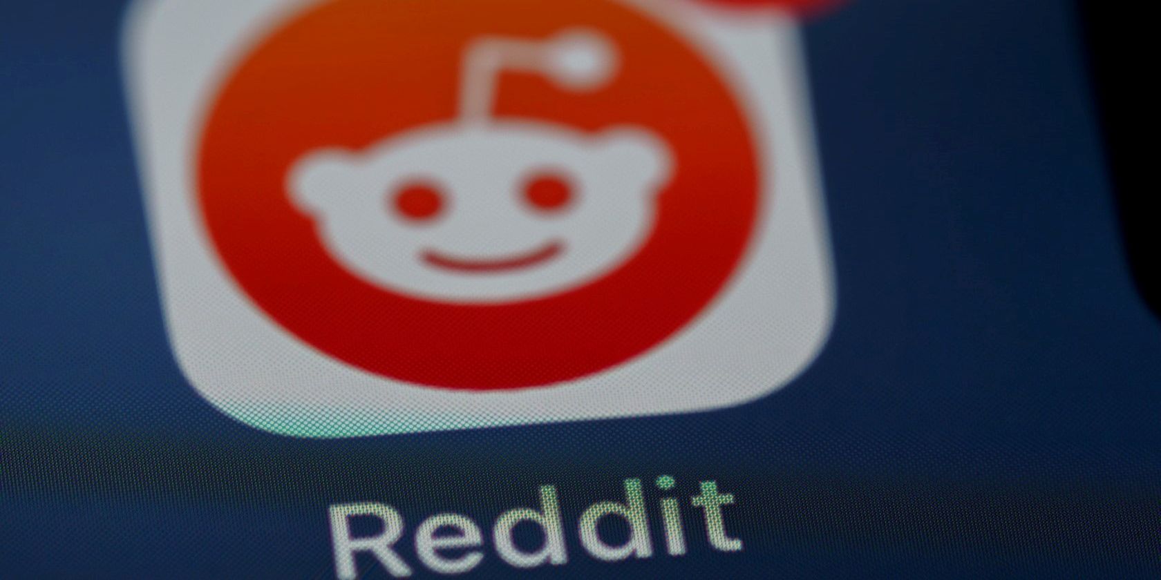 Reddit app logo on a smartphone