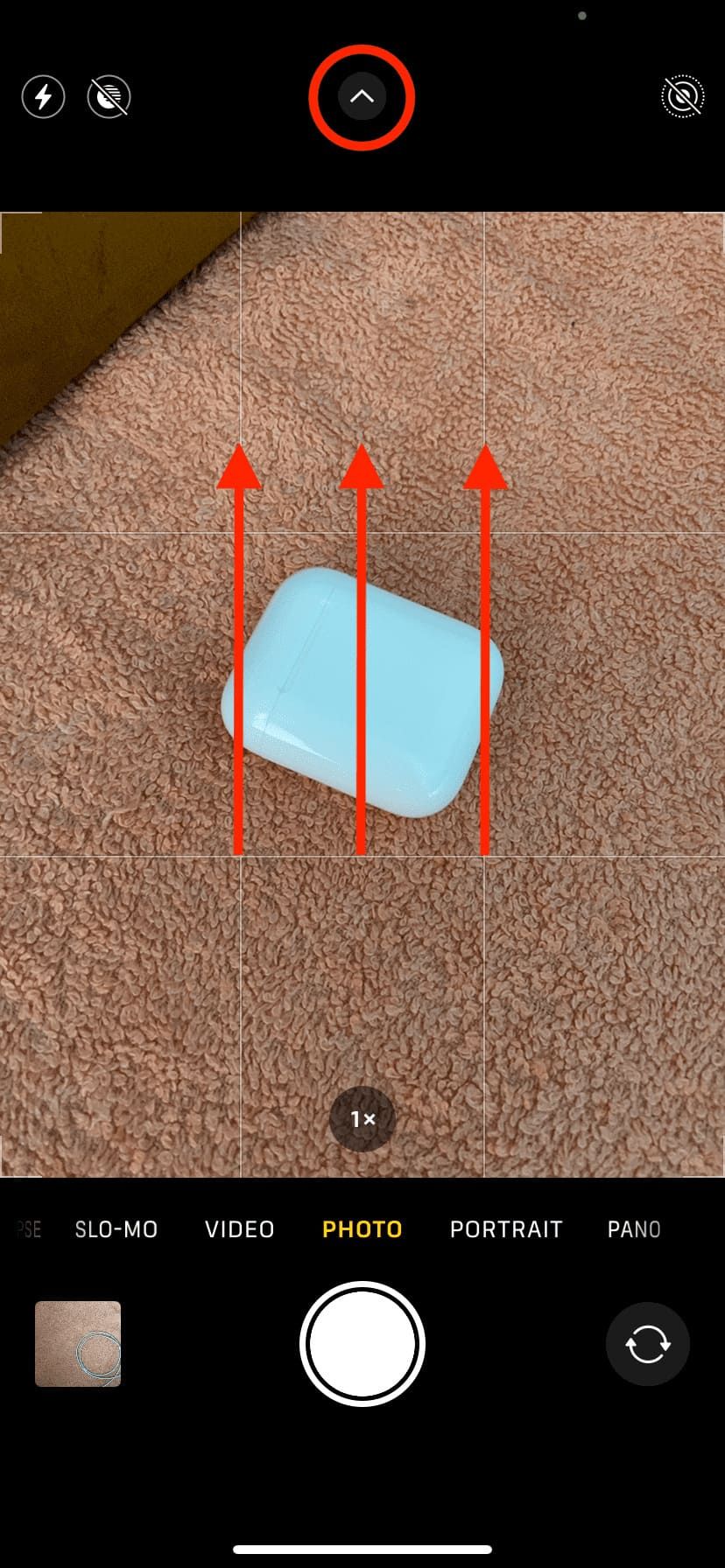 Swipe up or tap tiny arrow on newer iPhones inside the Camera screen