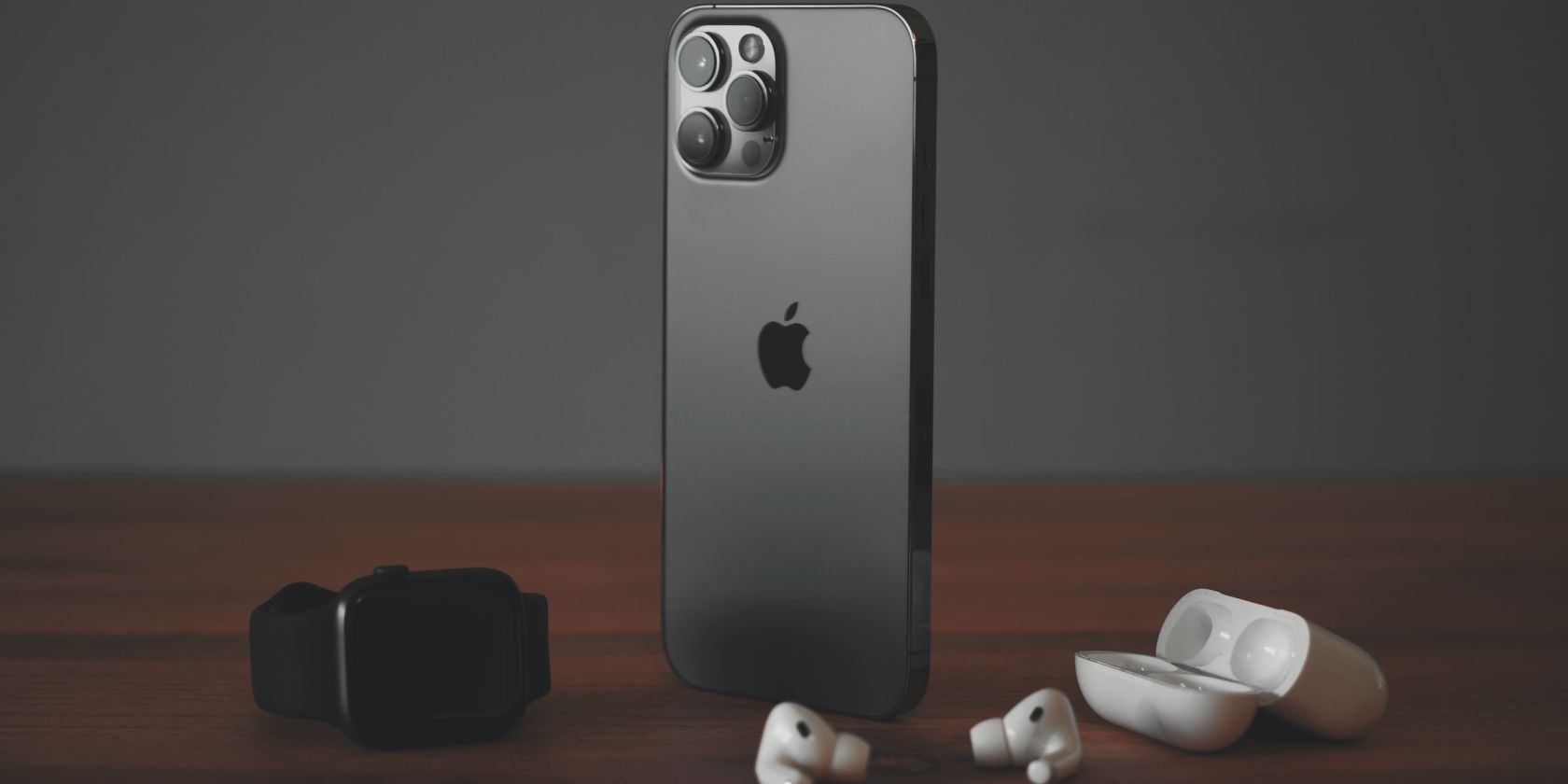 iPhone, Apple Watch, and AirPods on the table