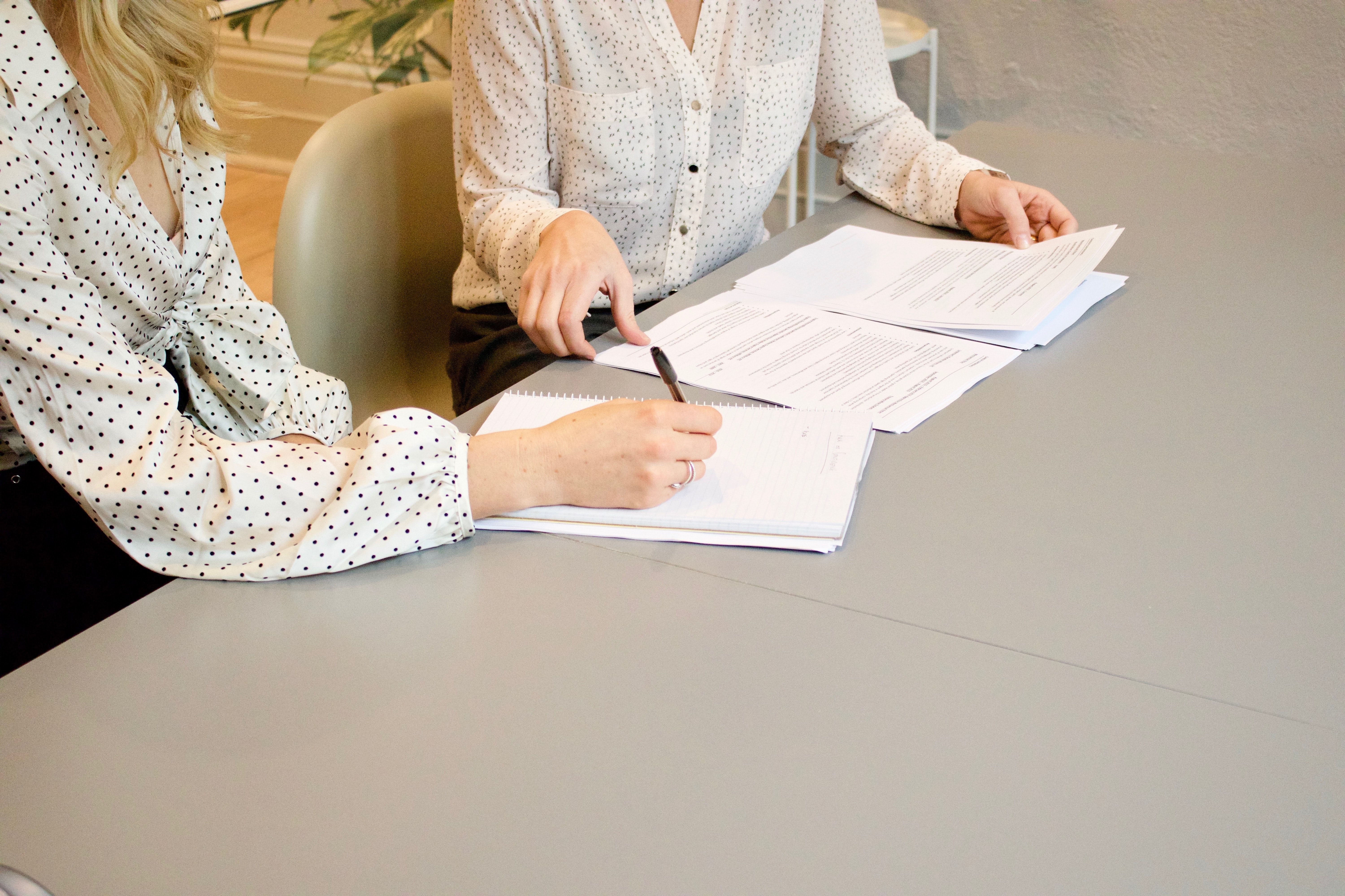 Two people working on a document together