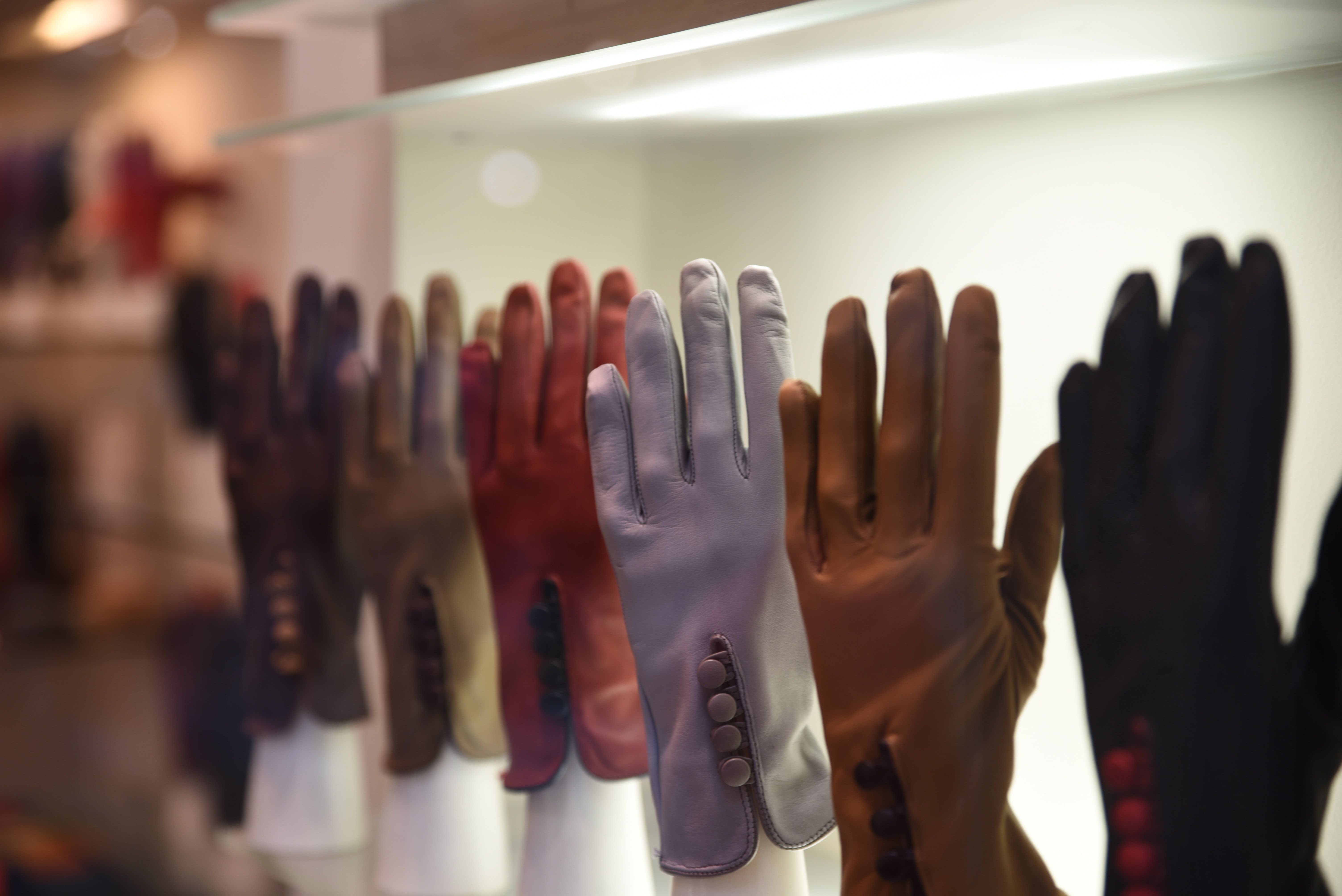 Assorted gloves on a rack