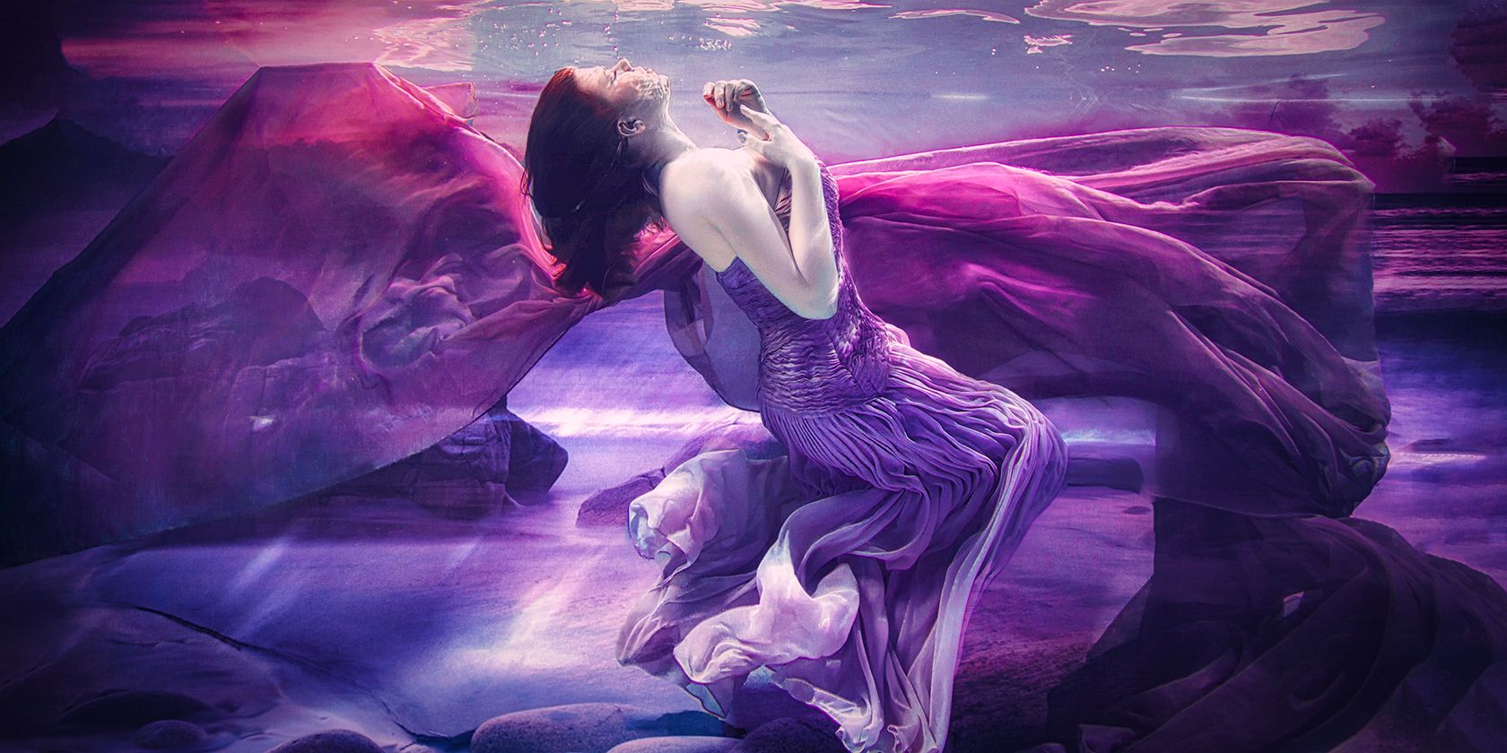 Underwater Image of Woman in Purple Dress
