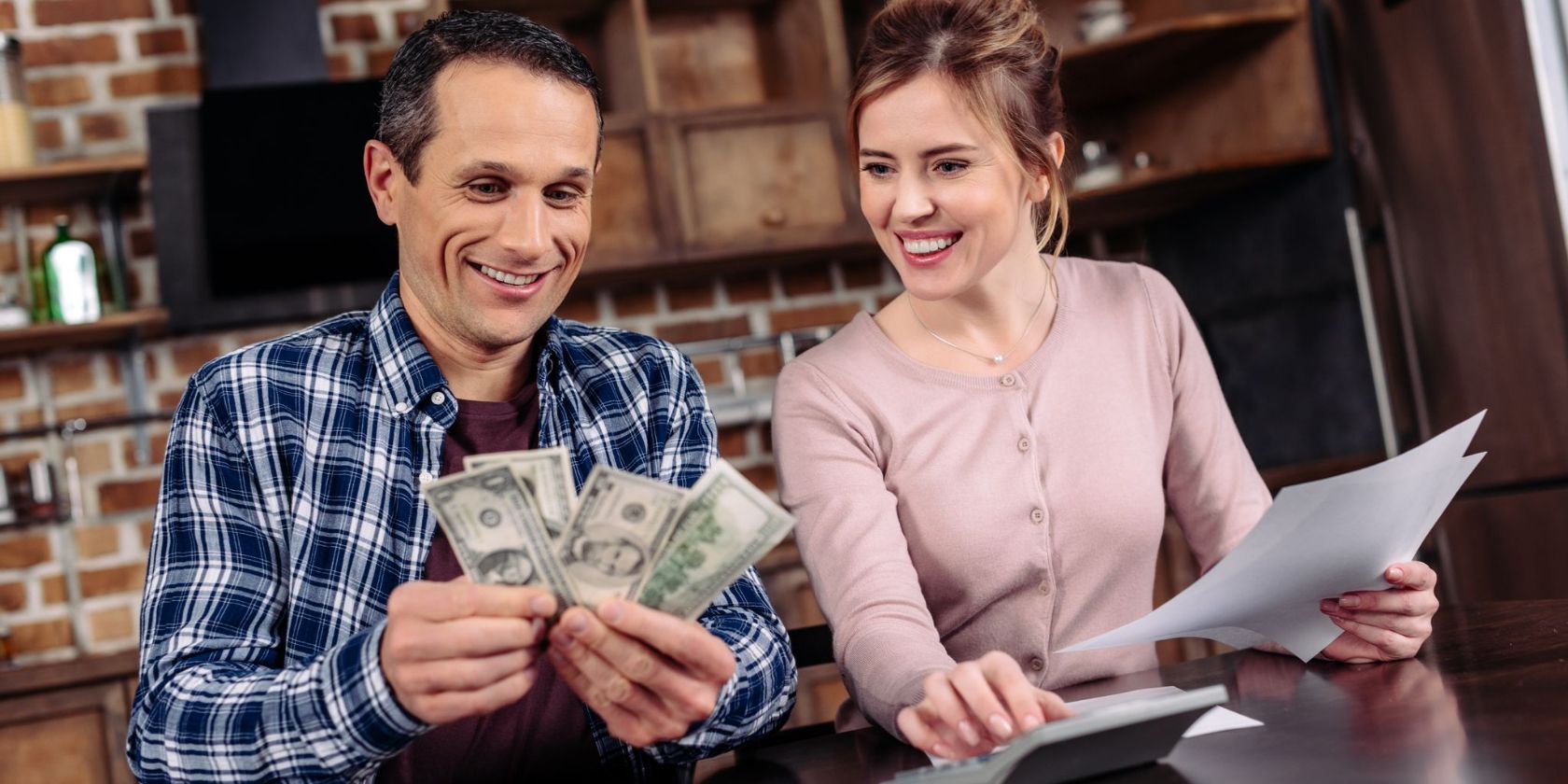A visual showing a man counting money and a women counting on calculator