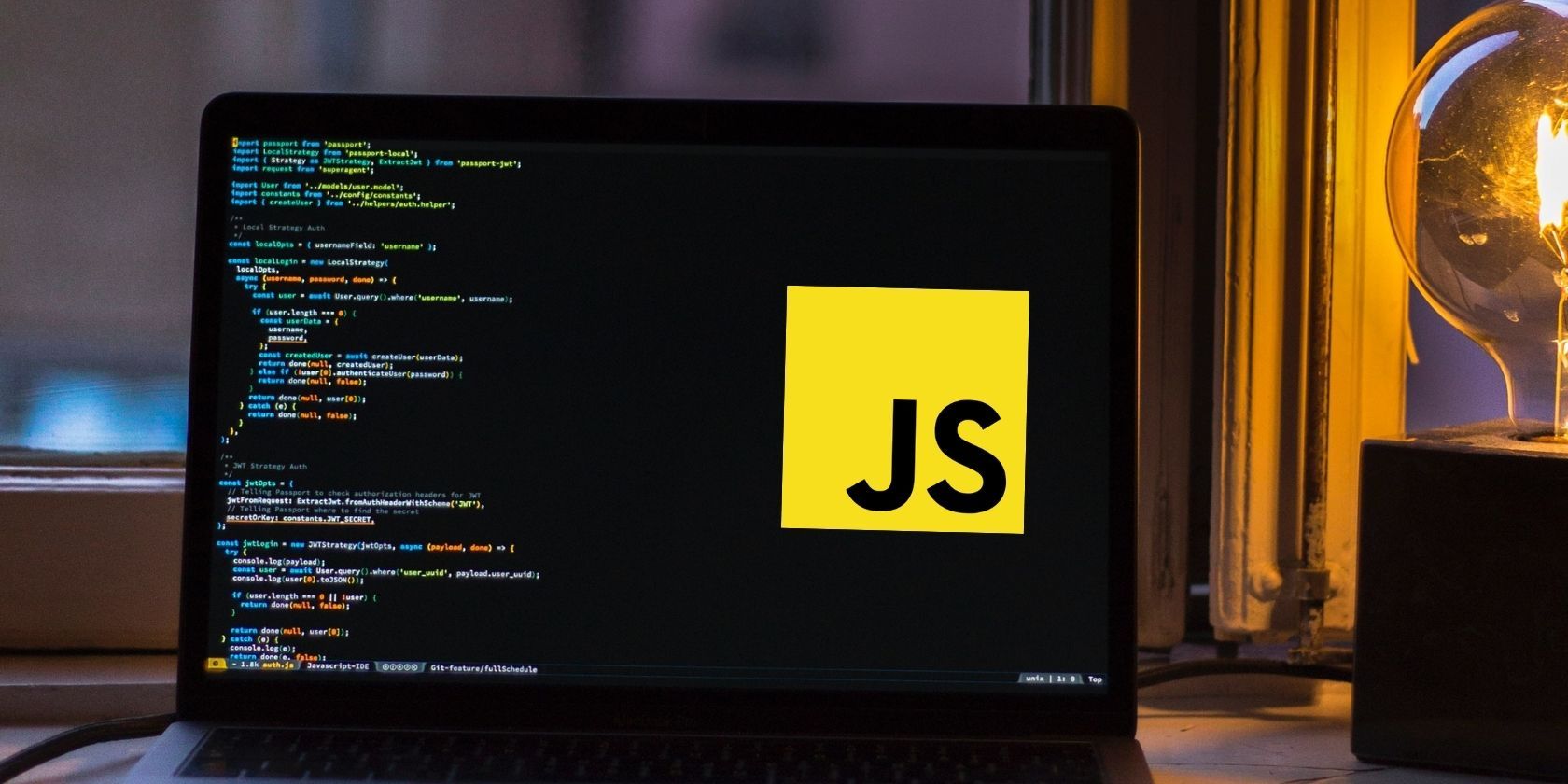 Picture of a laptop showing JS logo