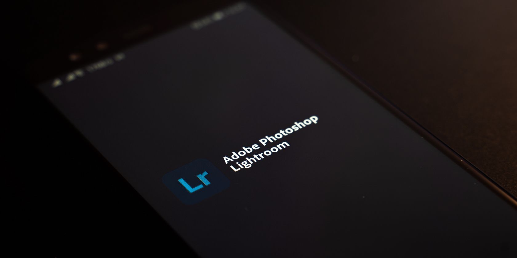 Photo of Adobe Lightroom on a smartphone screen