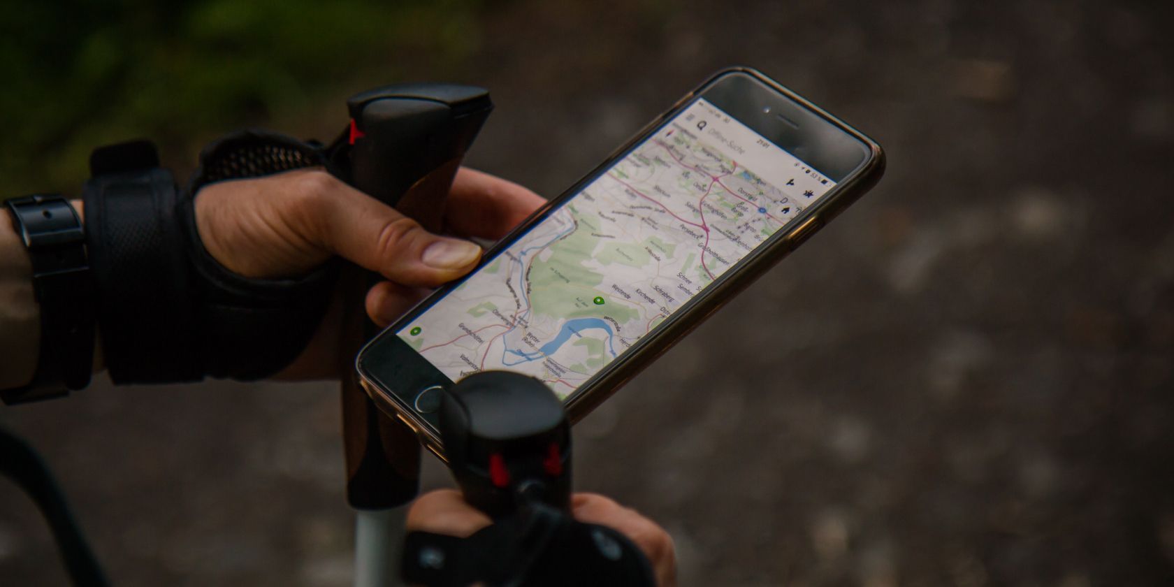 Photo of a person looking at a map on their iPhone