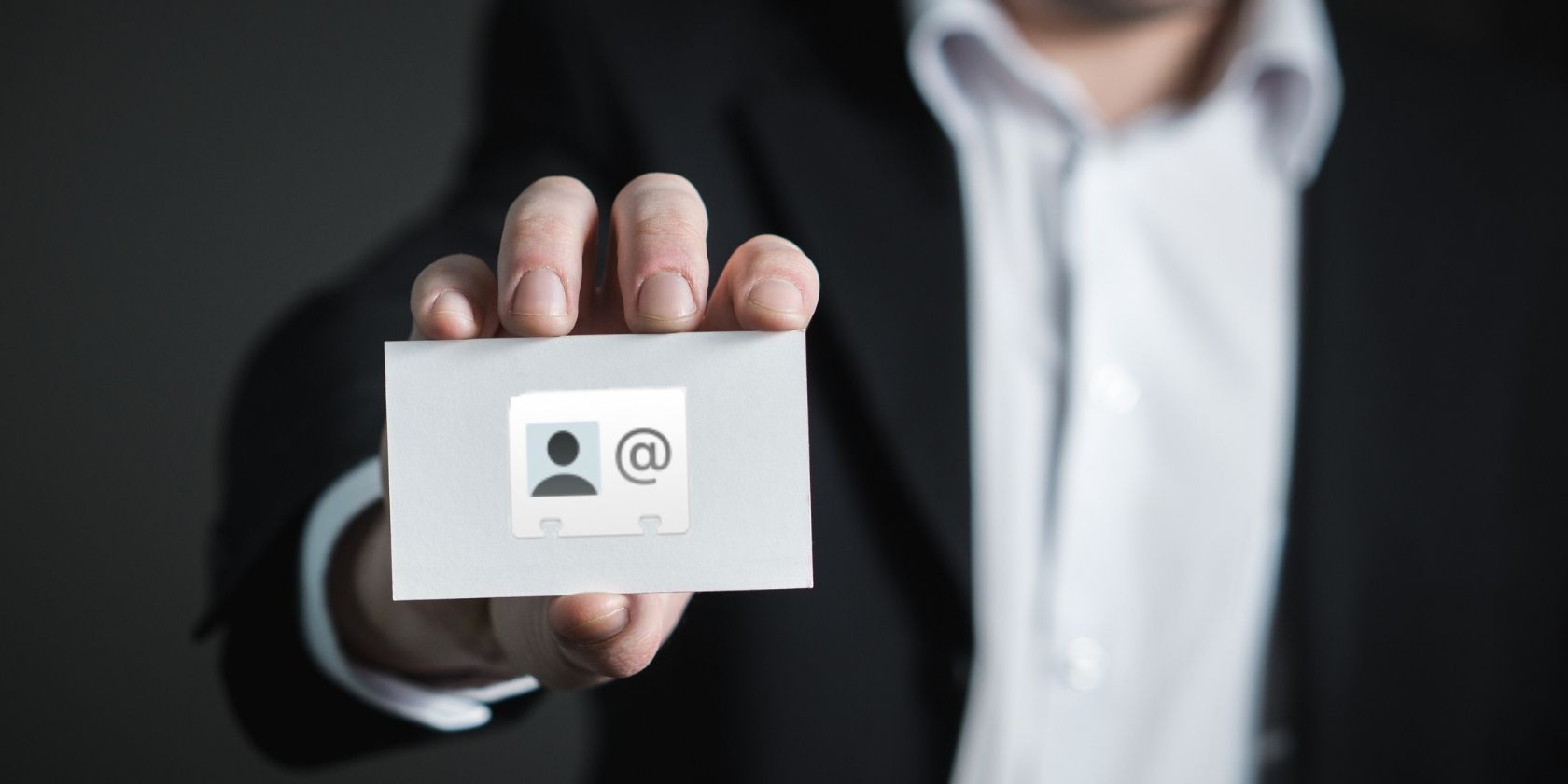 Person Holding a Business card with vCard Logo