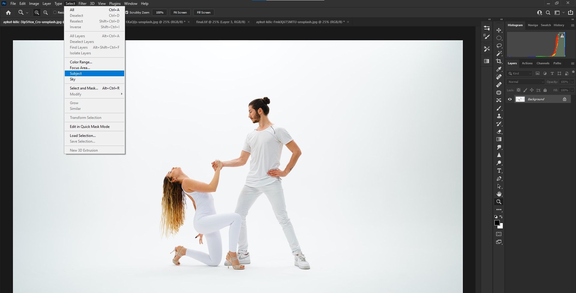 Male dancer holding onto female dancer.