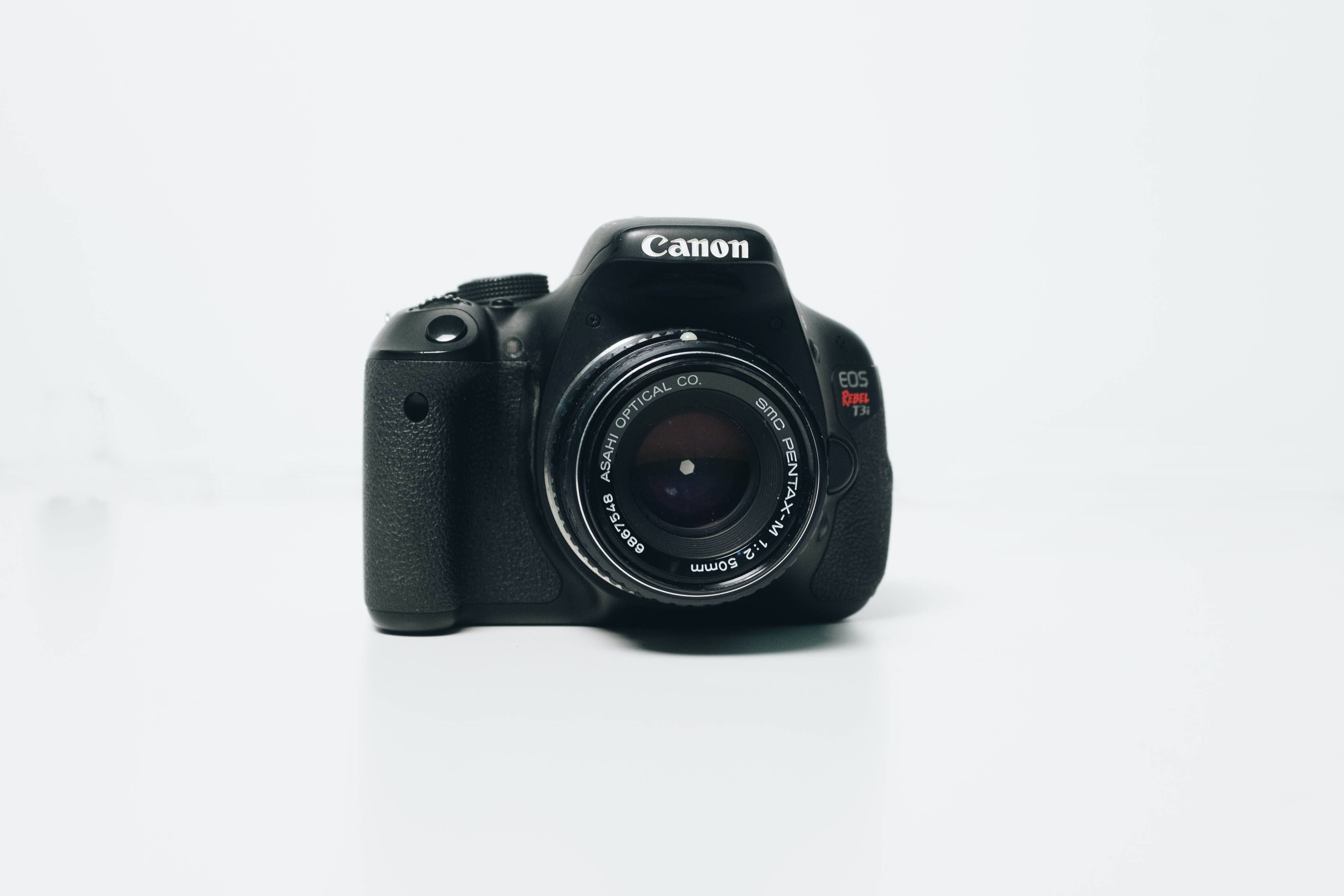A Canon Rebel T3i on a white field.
