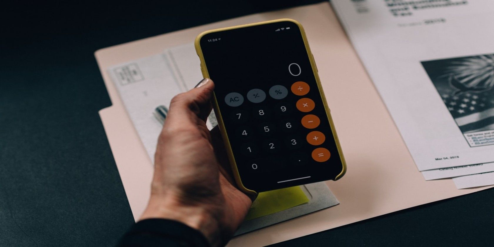 Person holding mobile using calculator app