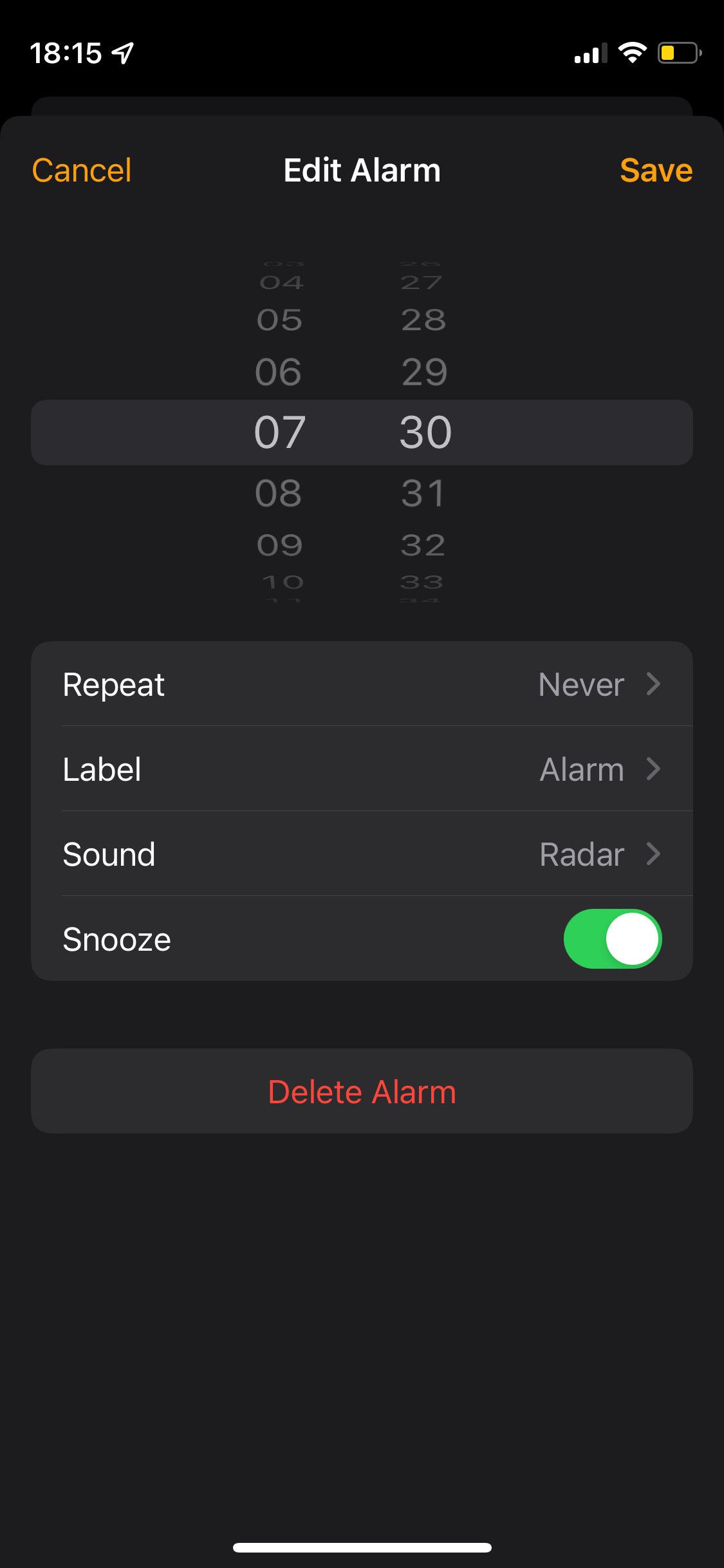iPhone Alarm app showing sliders for time