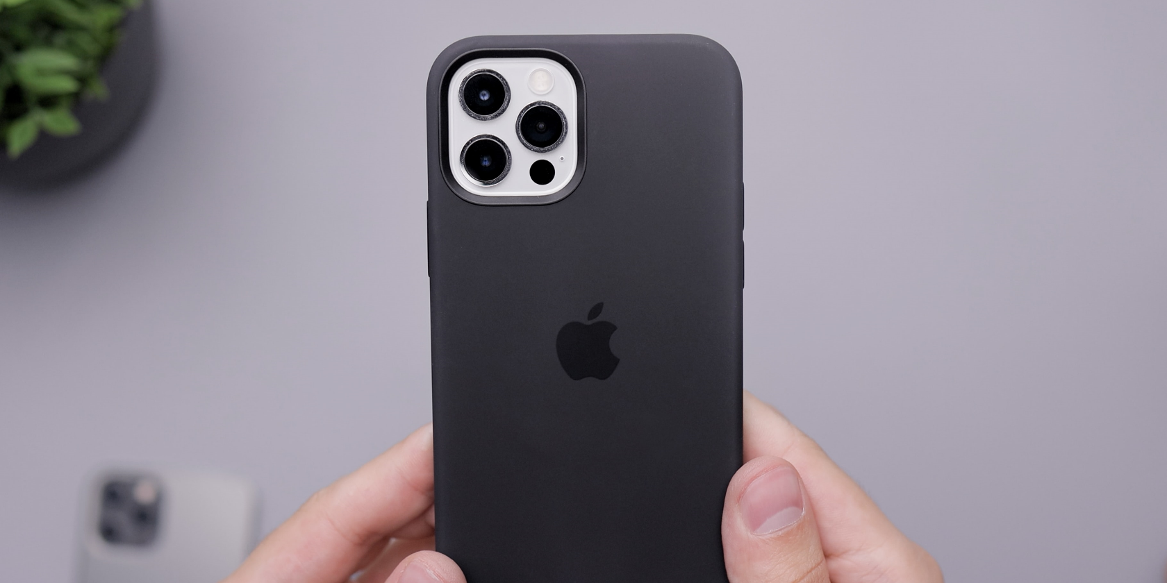 iphone 13 pro max case in black with hands holding the phone