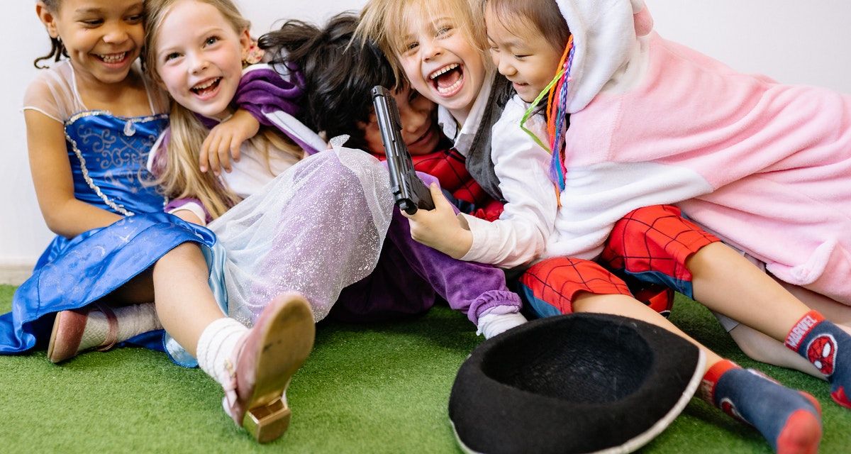 kids wearing costumes and laughing
