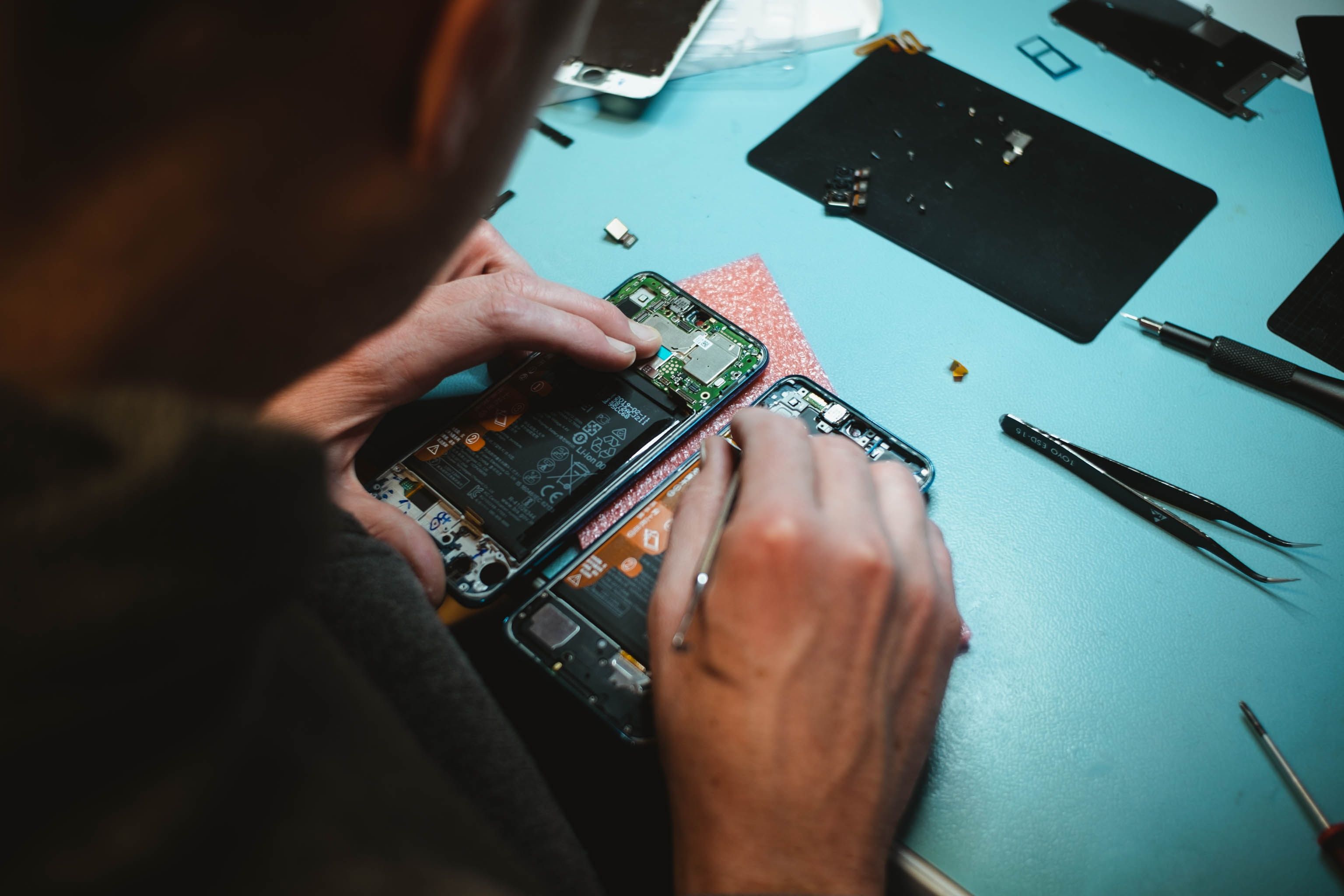 Man Repairing iPhone